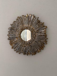 A pewter mirror