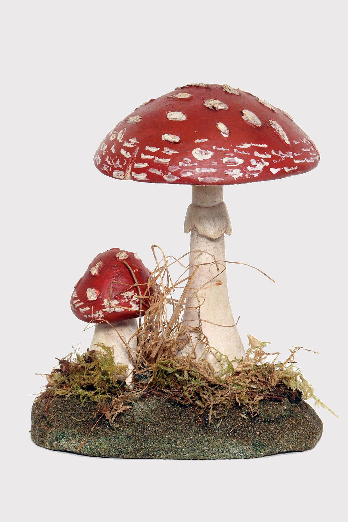 A pharmacy model of a specimen of Amanita Rubescens mushroom, made in painted plaster, on a green oval-shaped plaster base with moss and hay. Italy circa 1950.