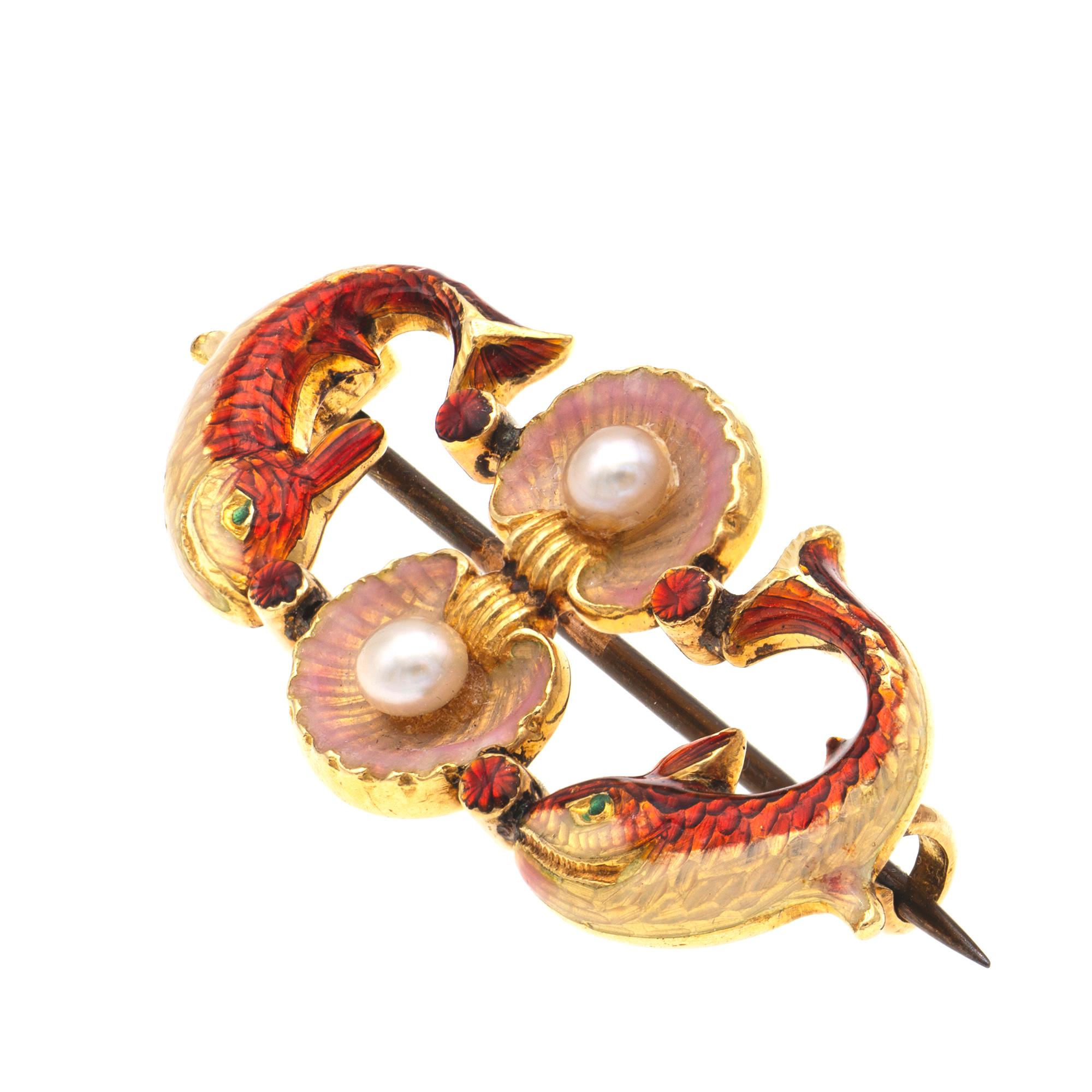 A Phillips red enamelled fish brooch, the two stylised fish enamelled in red and oyster colours, a pair of shells enamelled in pink iridescent colour, each centrally set with a pearl, joining the tails and the heads of the fish, all mounted in 18ct