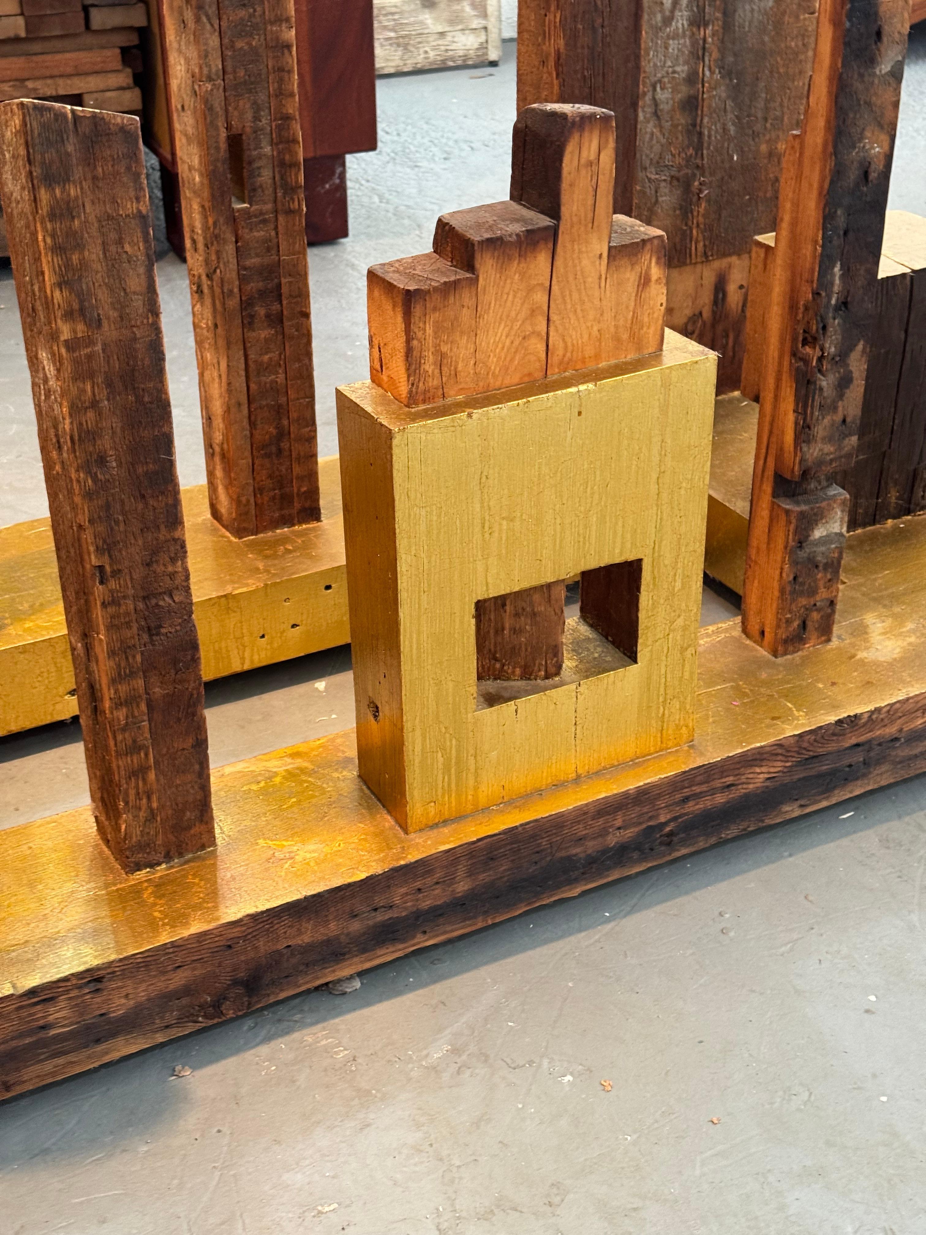 Rafael felt connected to Manhattan when he created A Piece of NYC art sculpture. This beautiful piece of art resembles the landscape of NYC, where he had lived for many years. He used reclaimed 150-year-old Douglas fir beams he salvaged from