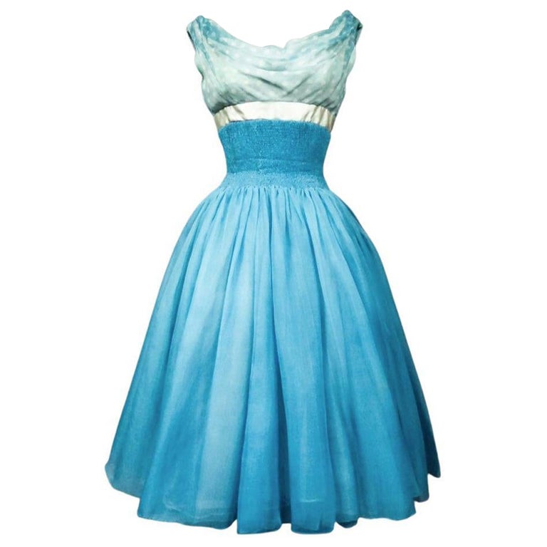 1958 cocktail dresses Satin cocktail dress by Heinz Oestergaard. 1958 News Photo