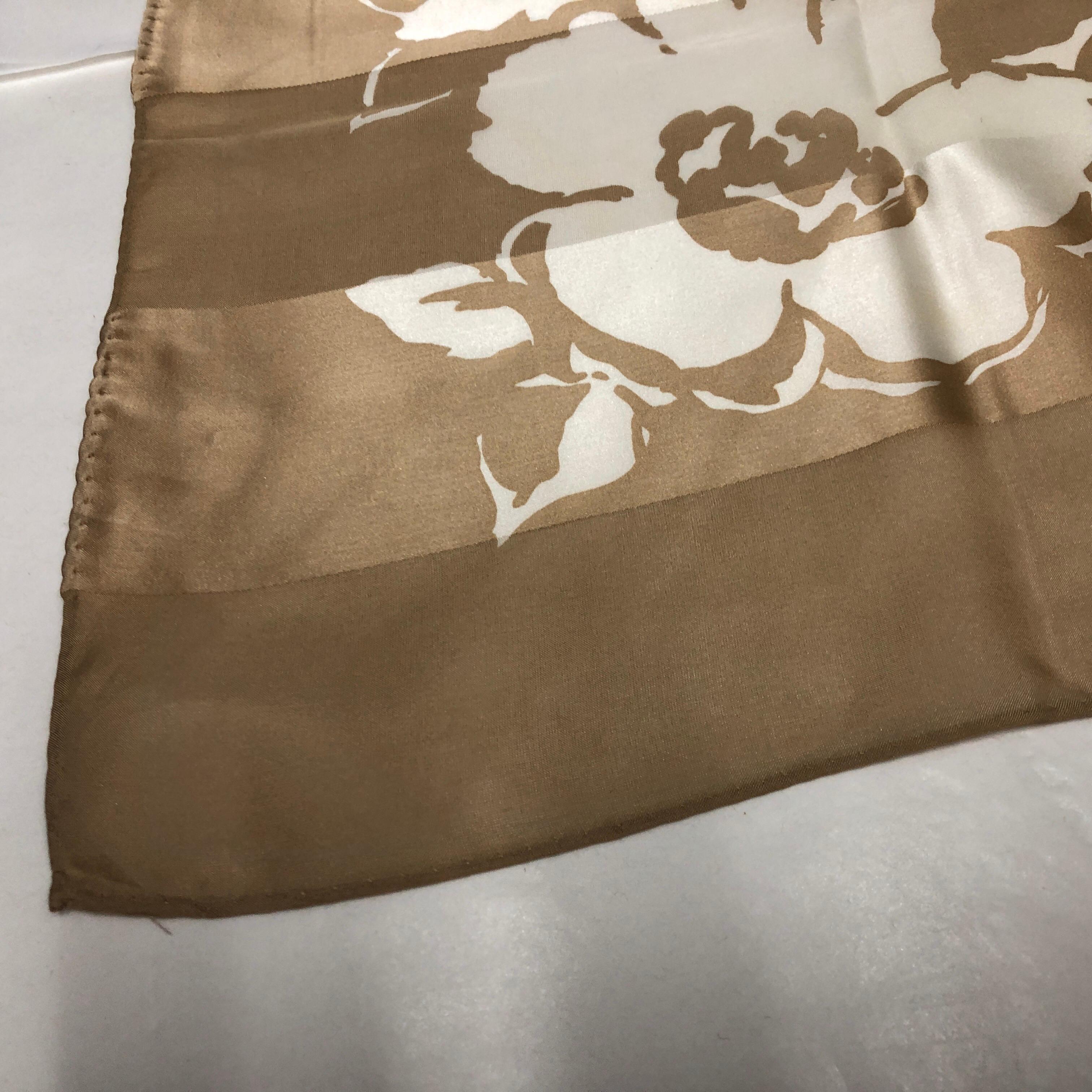 A lovely floral silk foulard designed  by Pierre Balmain in perfect conditions. The Pierre Balmain Silk Foulard is a luxurious and exquisite accessory that embodies the elegance and sophistication for which the renowned fashion house is known.