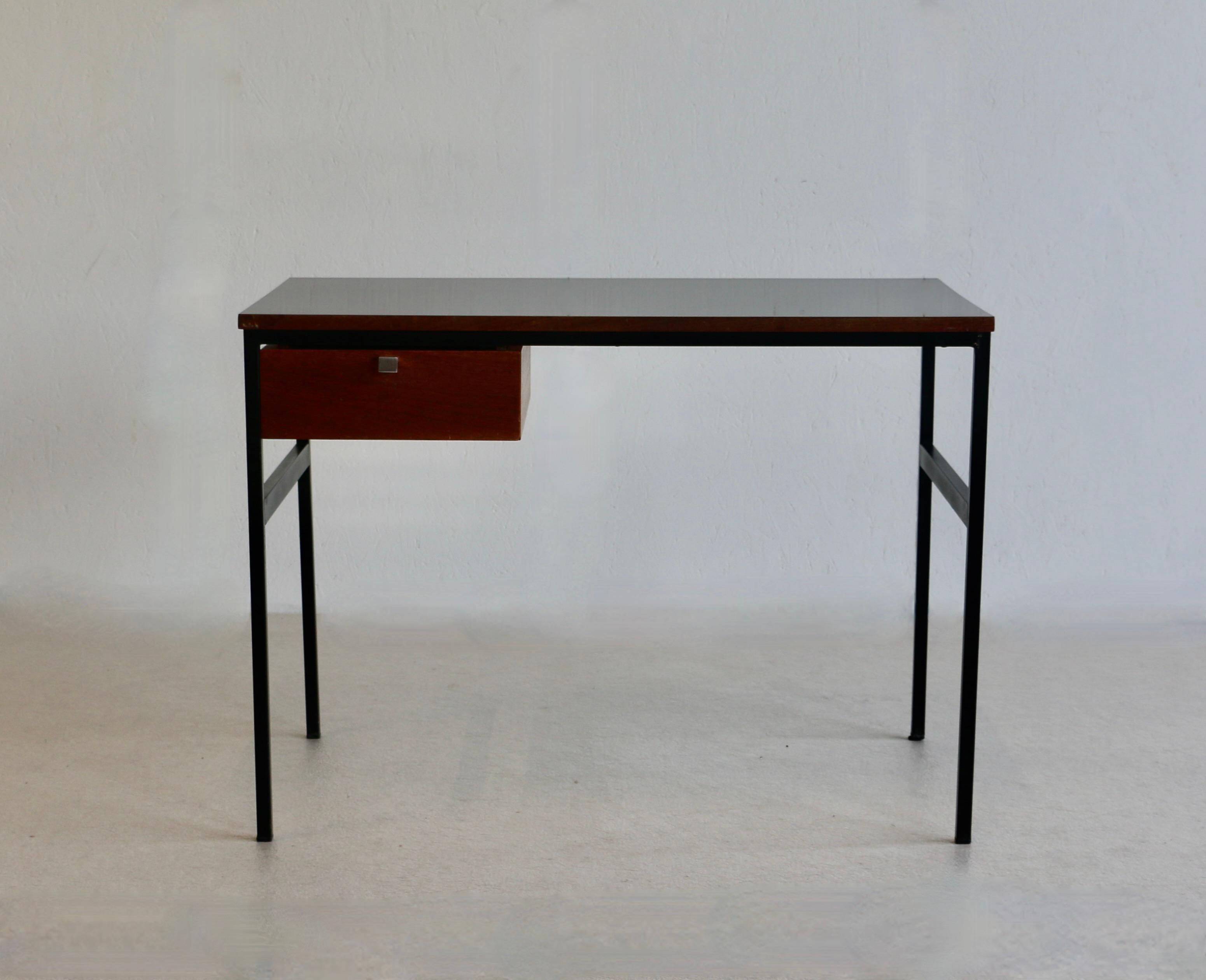 A very rare Pierre Paulin (1922-2009) model CM 217 desk with square tubular legs in black lacquered metal on which rests a plywood top covered with black laminate, suspended pedestal opening with a teak drawer France Edition Thonet 1962 The desk is