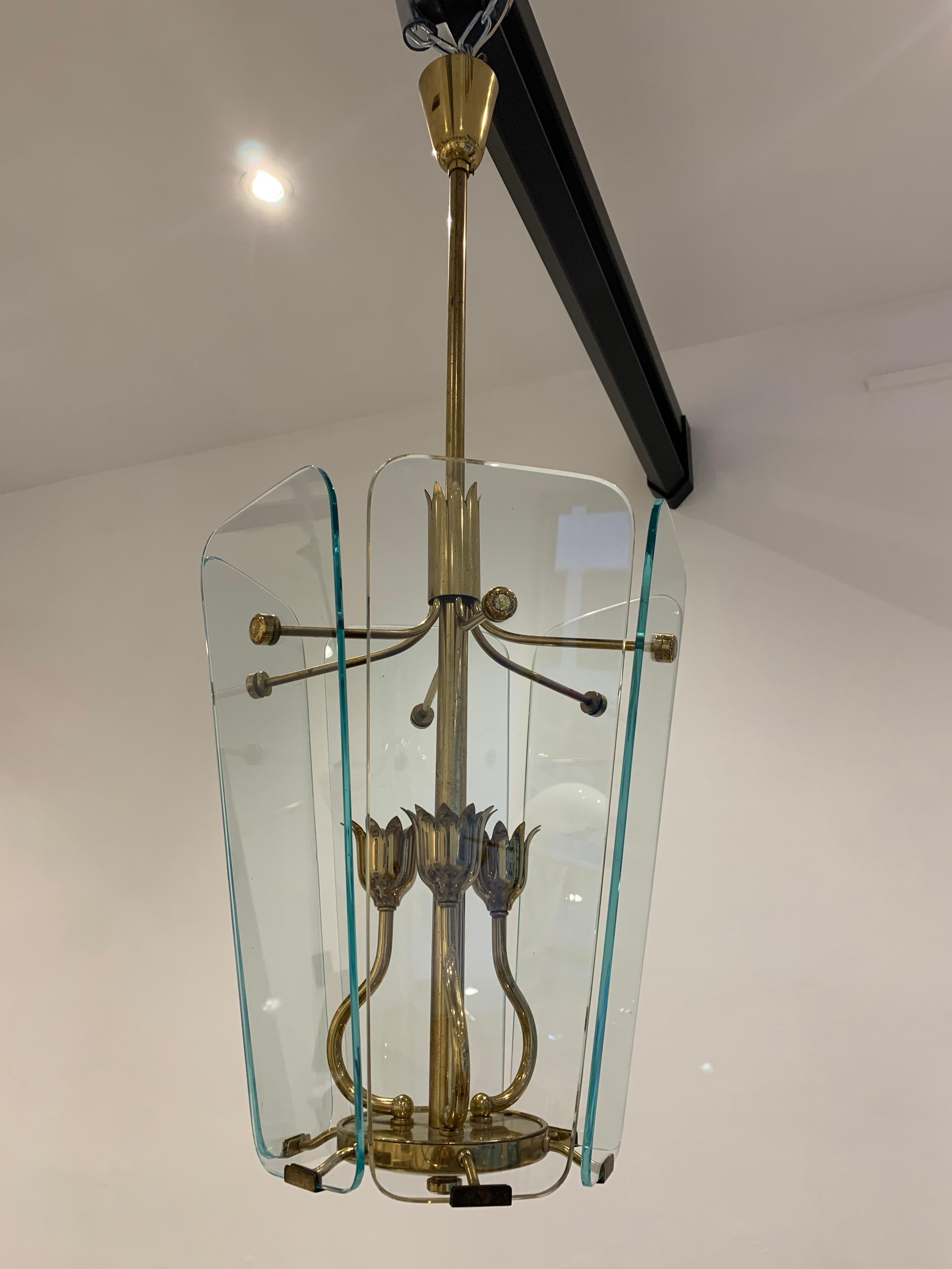 Pietro Chiesa was the artistic director of Fontana Arte in the 1930s. This work, whith brass flowers is typical of his style. He produced items using the same design. The lantern is of great quality.

 