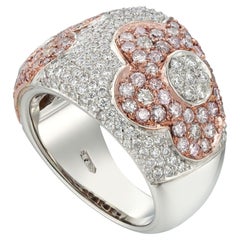 A pink and white diamond pave ring