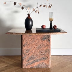 A postmodern pink granite side table, late 20th century