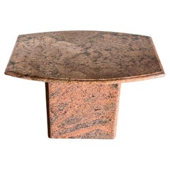 A postmodern pink granite side table, late 20th century