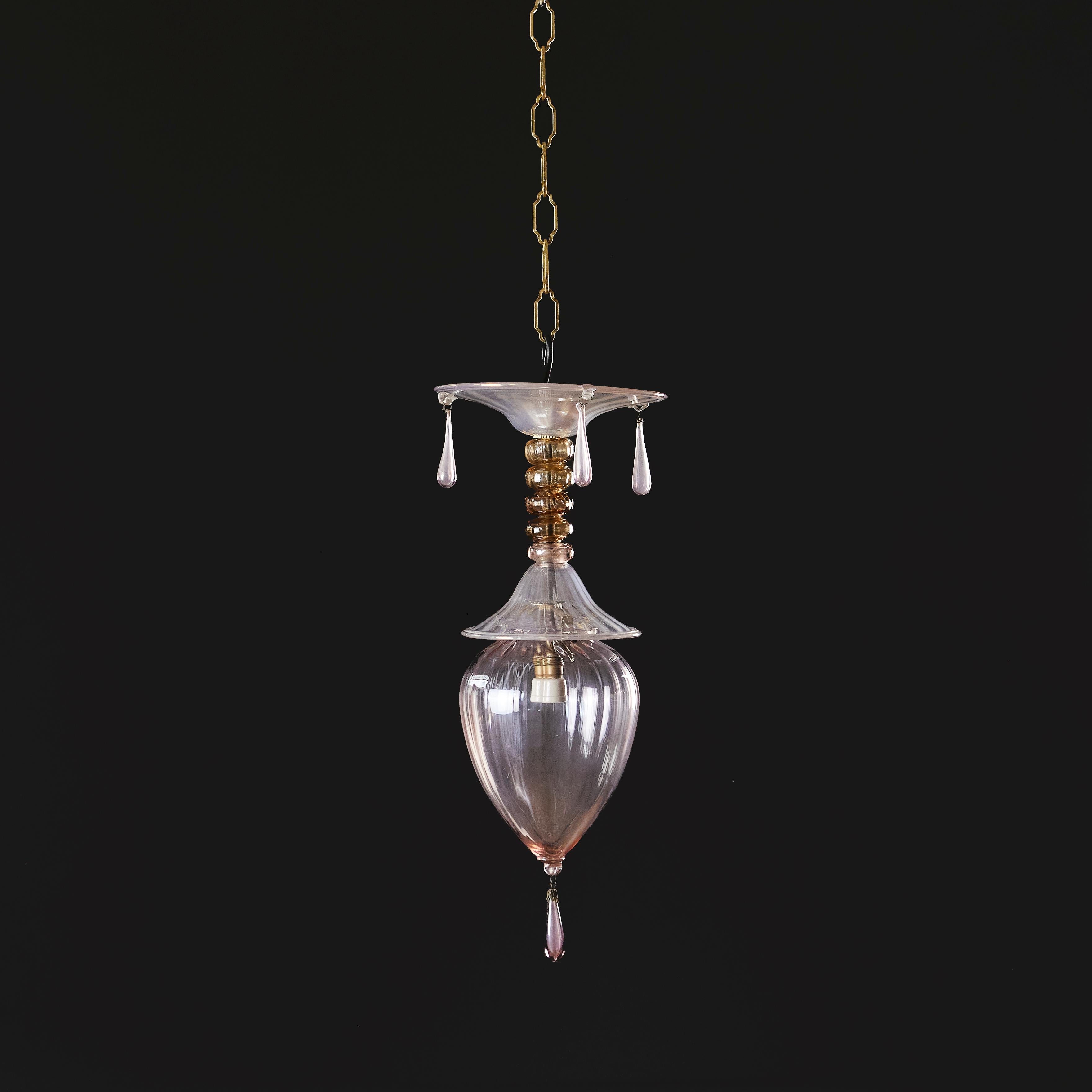 Italy, circa 1926

An early twentieth century pink Murano glass hanging light by Vittorio Zecchin, with teardrop shaped body, and circular top with three droplets. 

Overall height (without chain)     47.00cm

Diameter    15.00cm