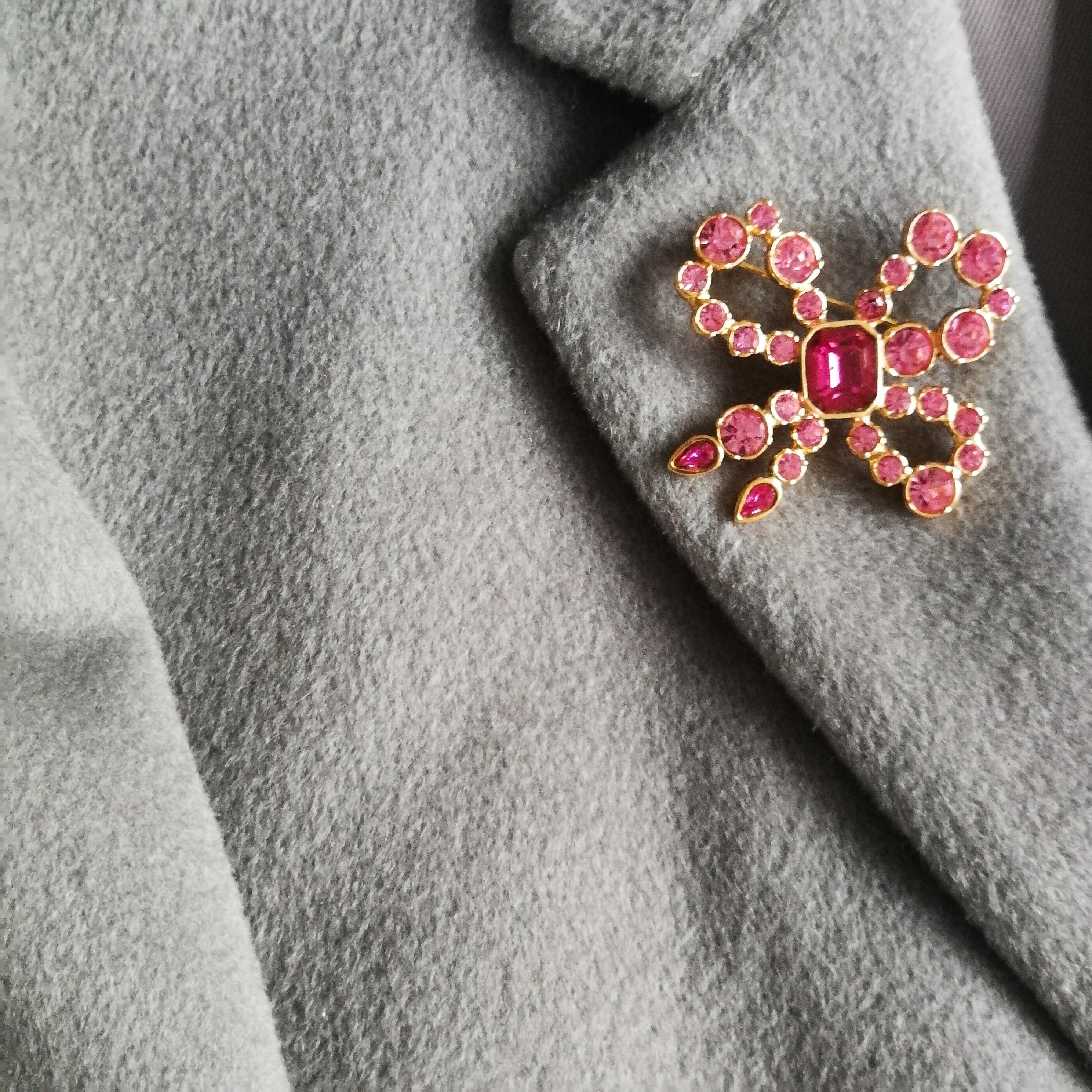 A pink paste and gilt metal 'bow' brooch, Yves Saint Laurent, France, 1980s 2