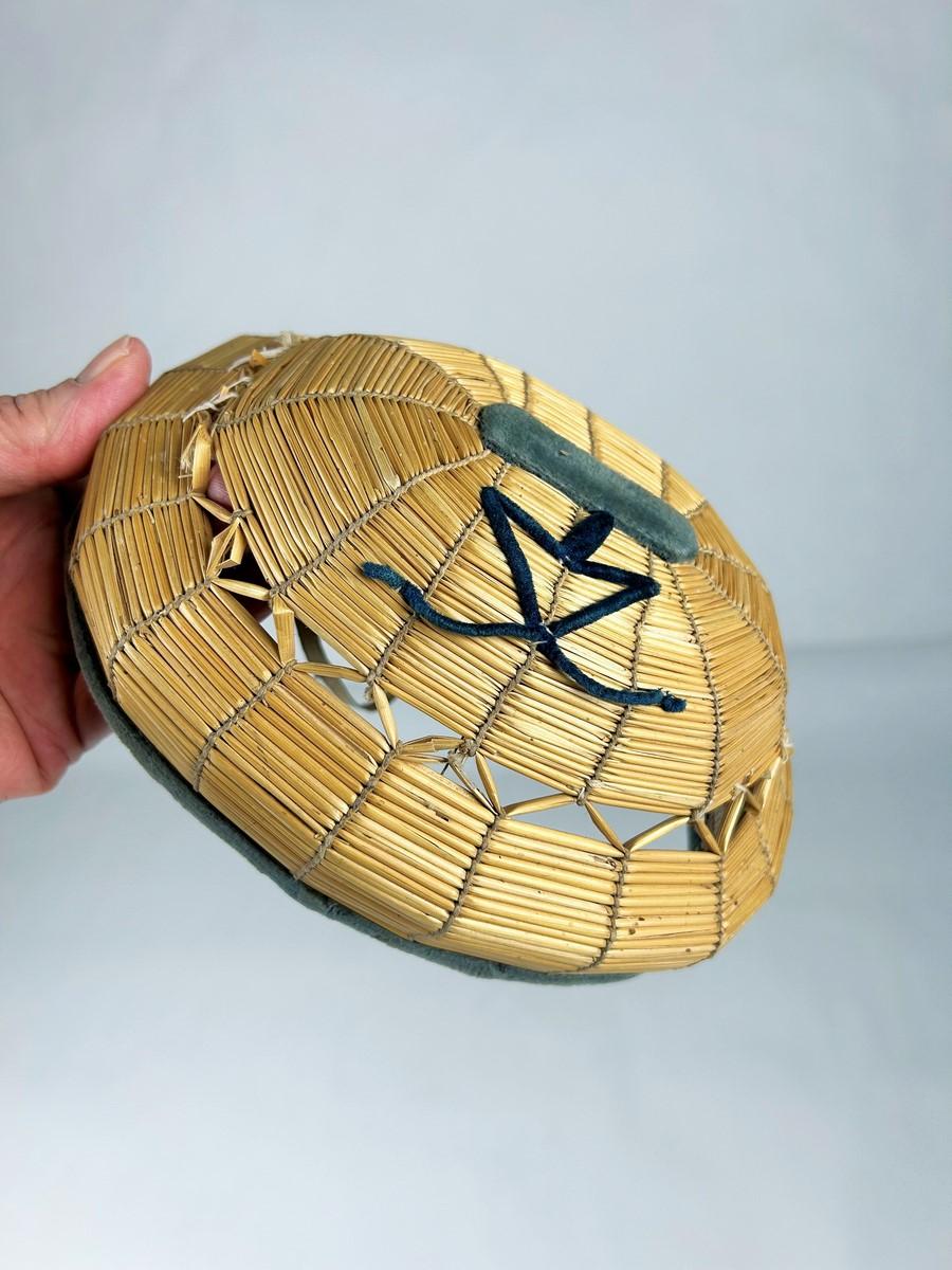 Circa 1850-1880
France

Precious tuyautée straw embroidery Baby's Headband from the French Second Empire period. This is a small oval-shaped helmet used to protect the heads of young children learning to walk. Made from knotted and openwork straw