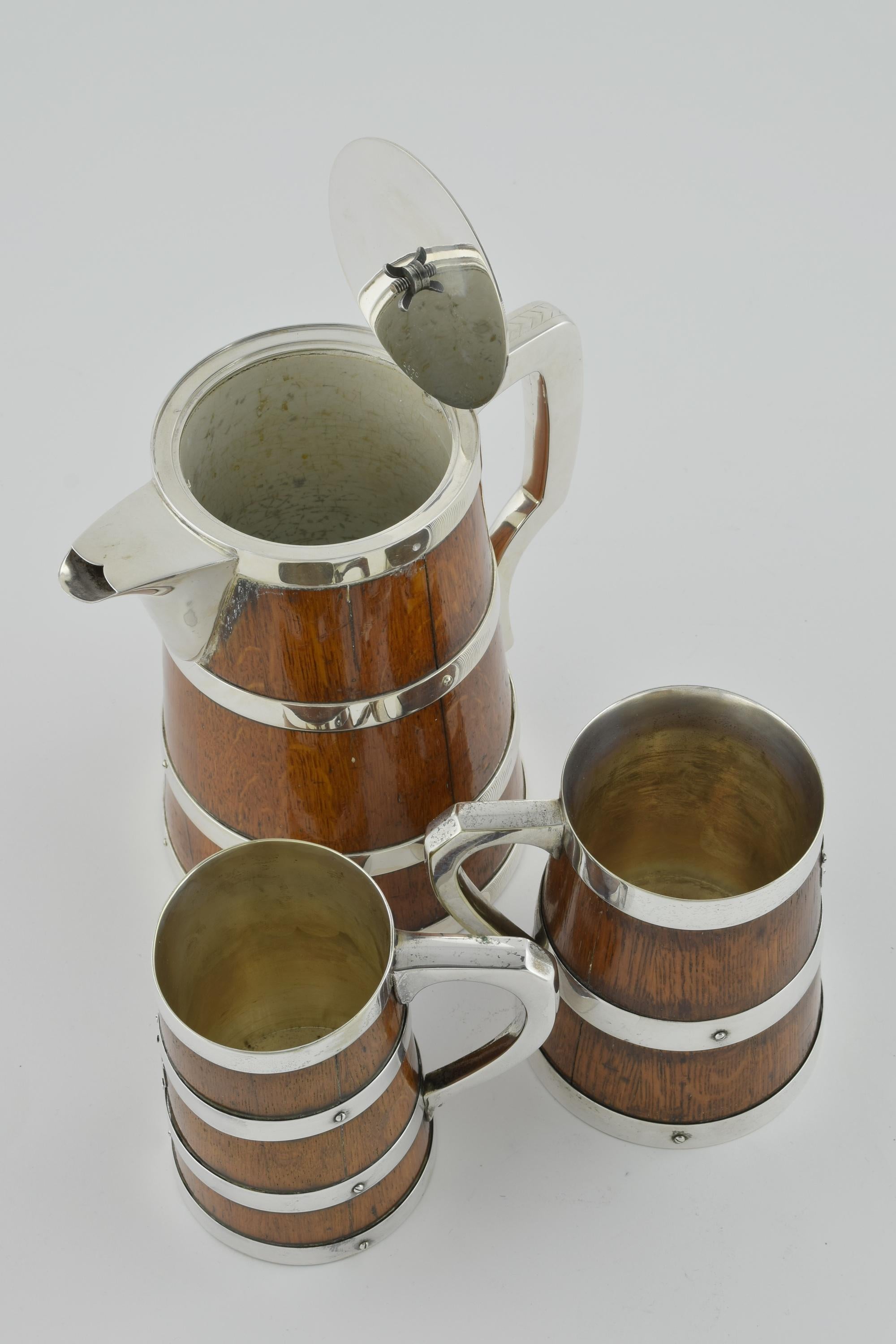 Silver Plate A Pitcher and two tankards For Sale