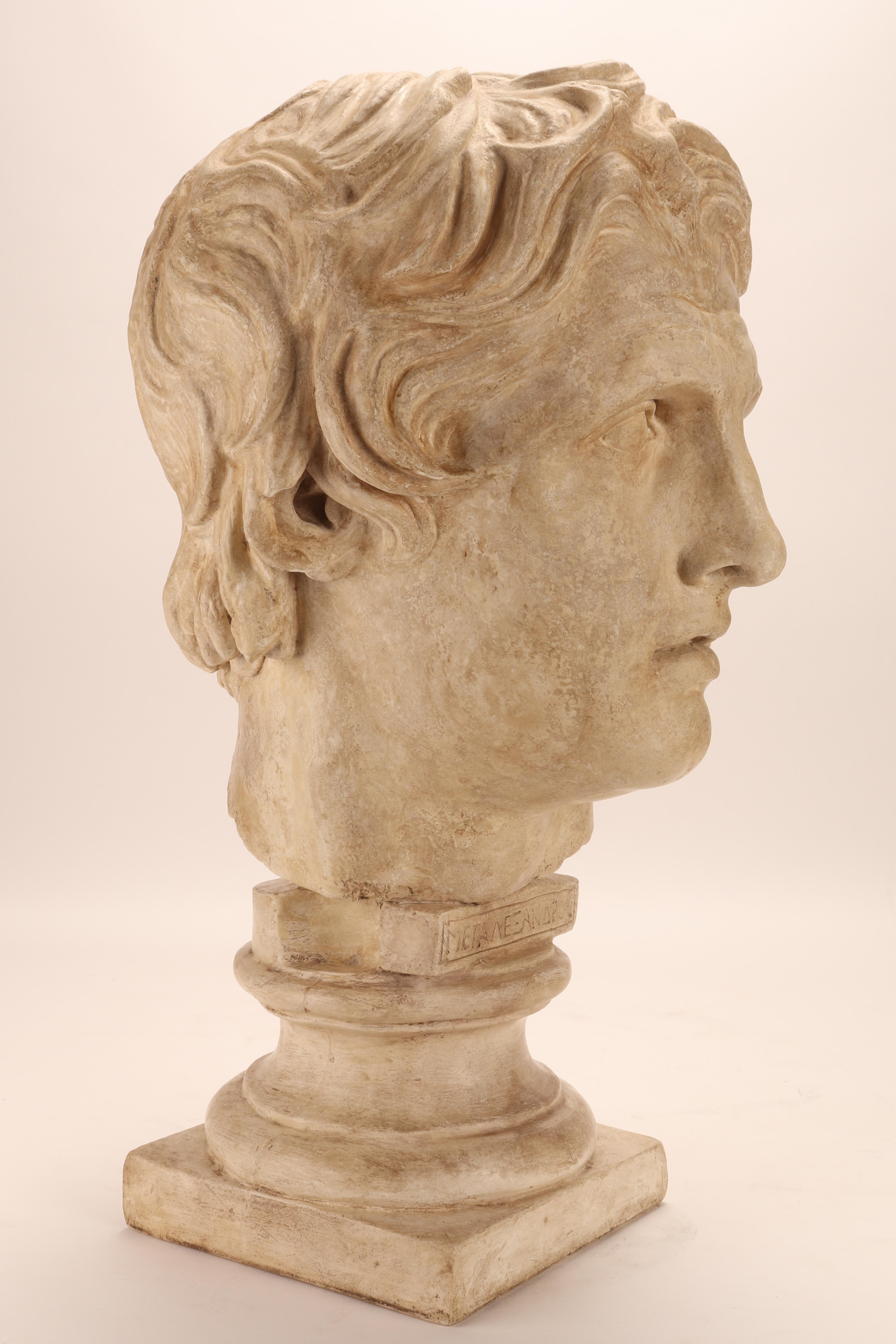 Over the plaster base is set the plaster cast of the head of Alexander the Great. Cast for drawing teaching in Academy. Italy circa 1890.