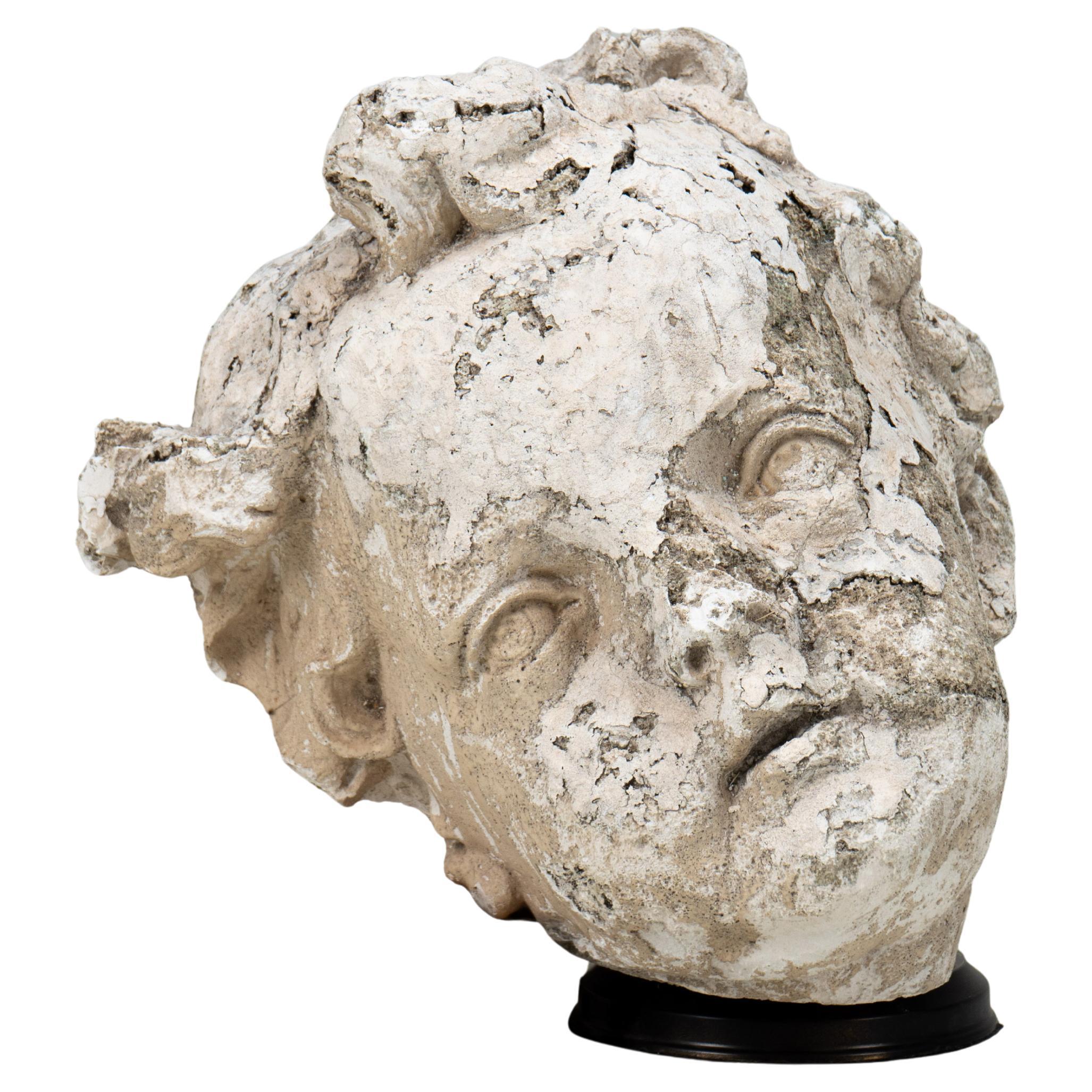 A Plaster Sculpture of an Infant Face