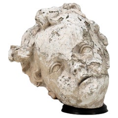 A Plaster Sculpture of an Infant Face