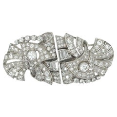 A Platinum and Diamond Clip Brooch A Platinum and Diamond Clip Brooch