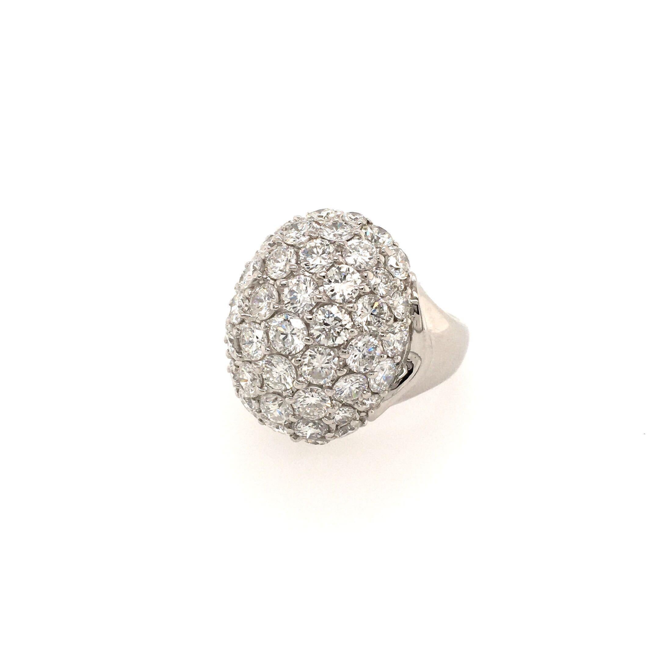A platinum and diamond dome ring. The top pave set with diamonds, with polished shank. Total diamond weight approximately 5.03 carats. Size 6 1/4, gross weight is approximately 15.7 grams.
