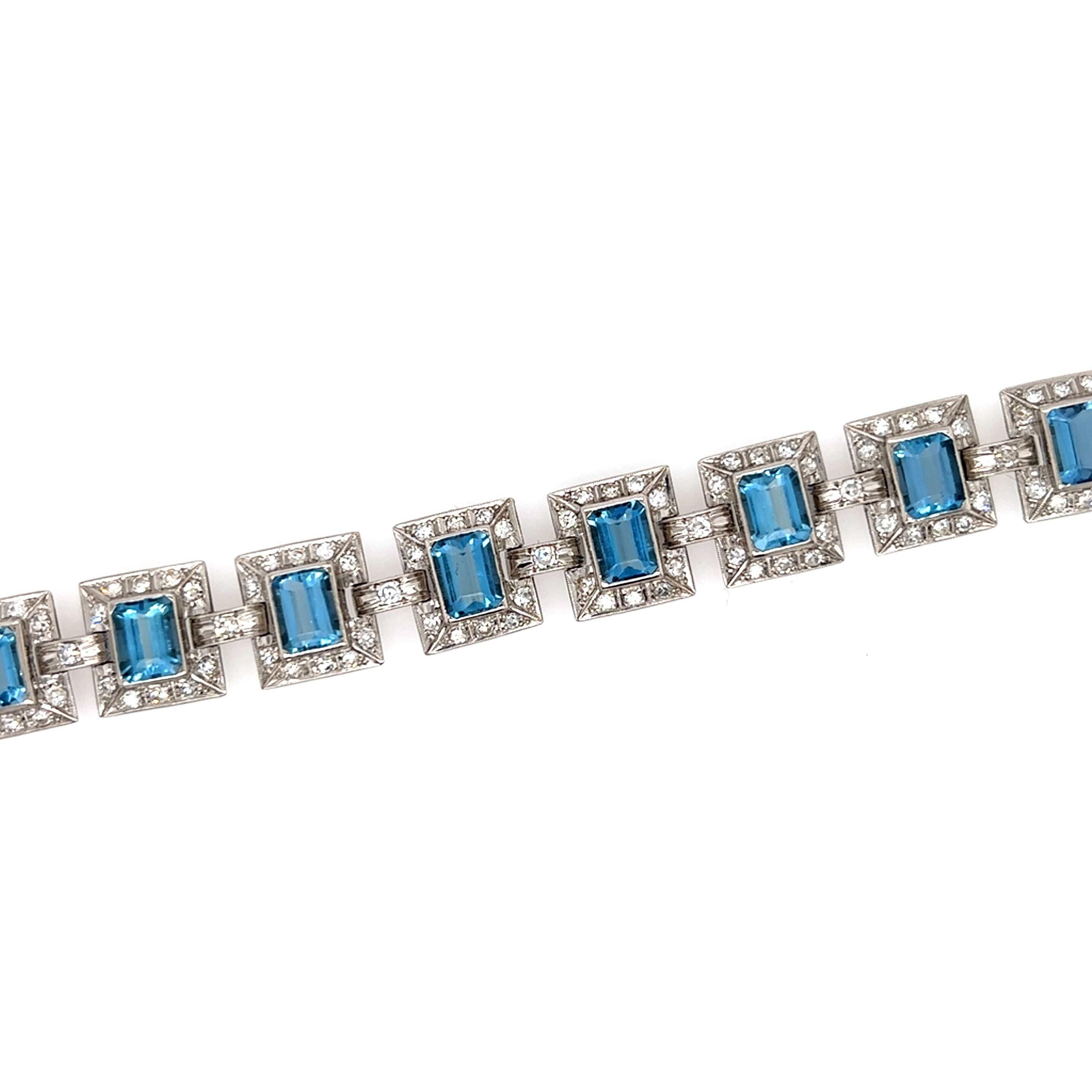 A platinum, aquamarine and diamond bracelet.  The bracelet formed of eleven (11) faceted rectangular aquamarines measuring approximately 6.87 x 5.27 mm. each within a frame of ten (10) brilliant cut diamonds and connected by links set with one (1)