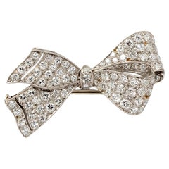 A Platinum Art Deco Bow Brooch with Diamonds