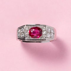 A Platinum Art Deco Ring Set with Diamonds and An Oval Facetted Burma Ruby