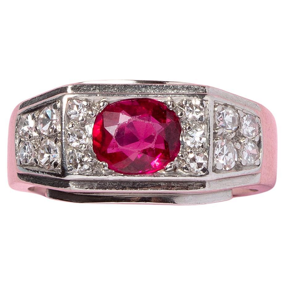 A Platinum Art Deco Ring Set with Diamonds and An Oval Facetted Burma Ruby For Sale