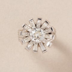 A platinum flower ring with diamonds