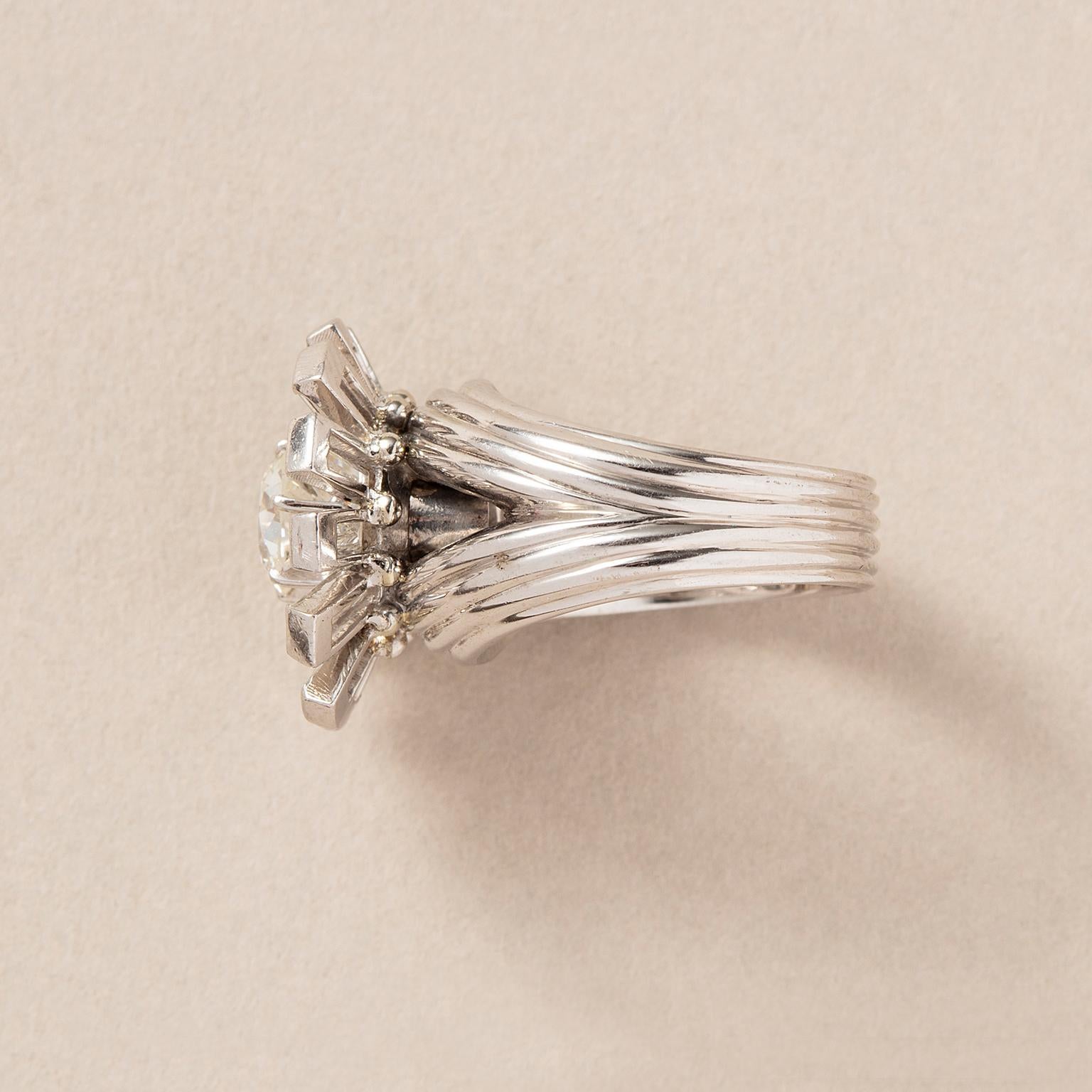 Baguette Cut A platinum flower ring with diamonds For Sale