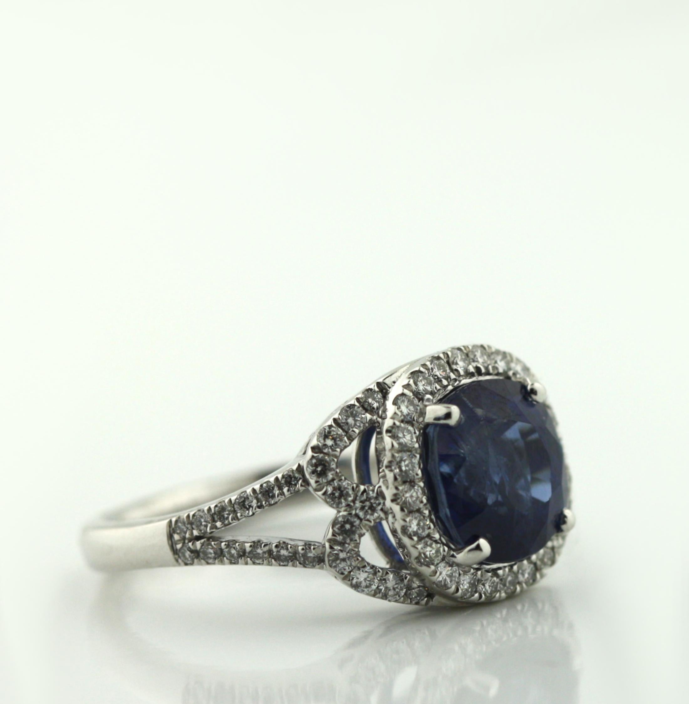 Round Cut A Platinum Sapphire, and Diamond Ring