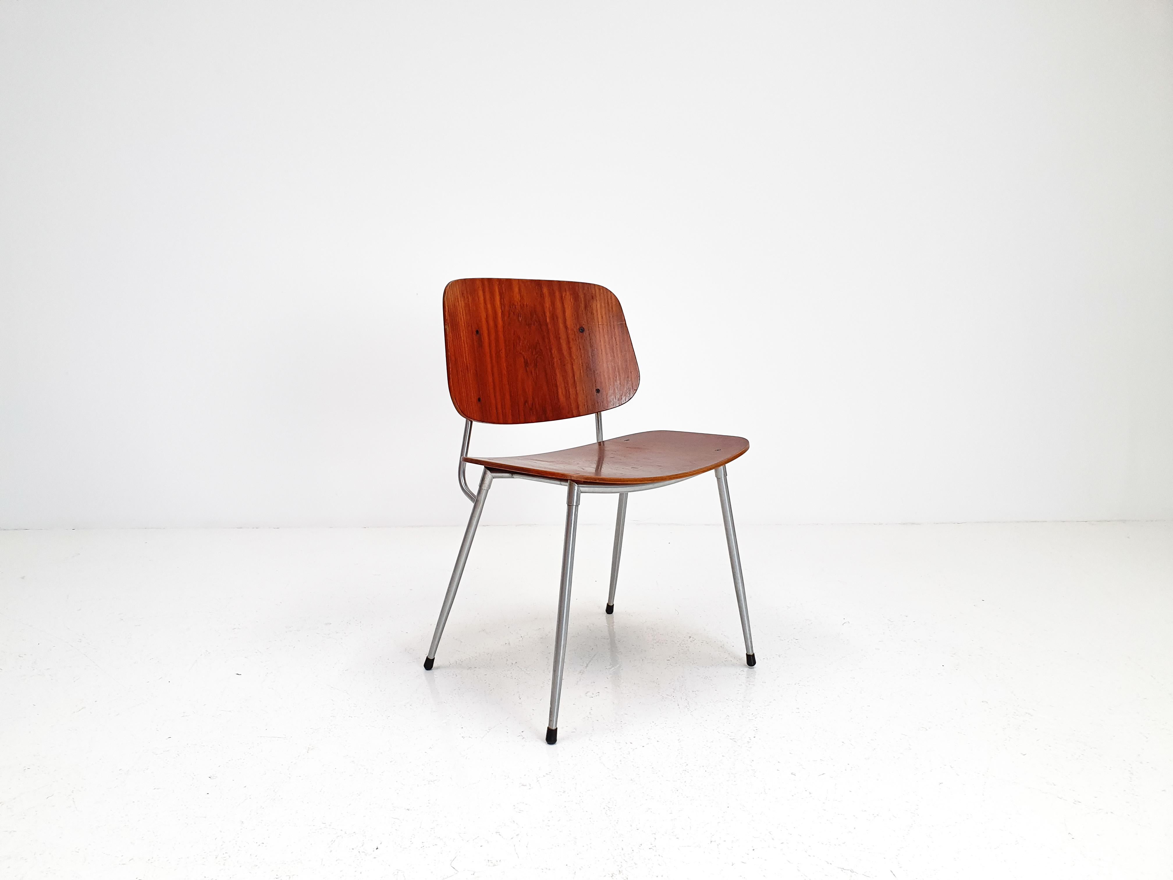 A plywood and steel chair by Børge Mogensen manufactured by Søborg Møbelfabrik, Denmark, 1953. 

In good original condition with minor wear consistent with age and use, we have not restored this piece so to preserve the wonderful patina. A rare