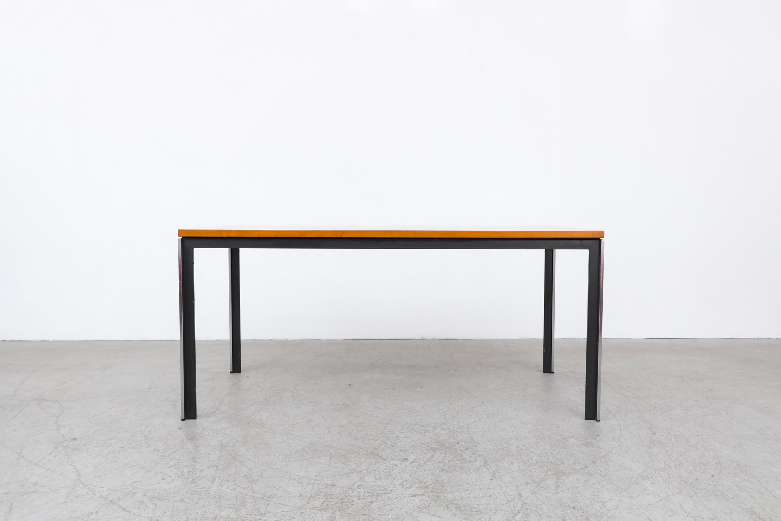 Architectural polak dining table or desk with original teak top, black enameled metal and polished steel Industrial frame. Innovative configuration of metal and polished steel. In original condition with visible wear and scratching consistent with