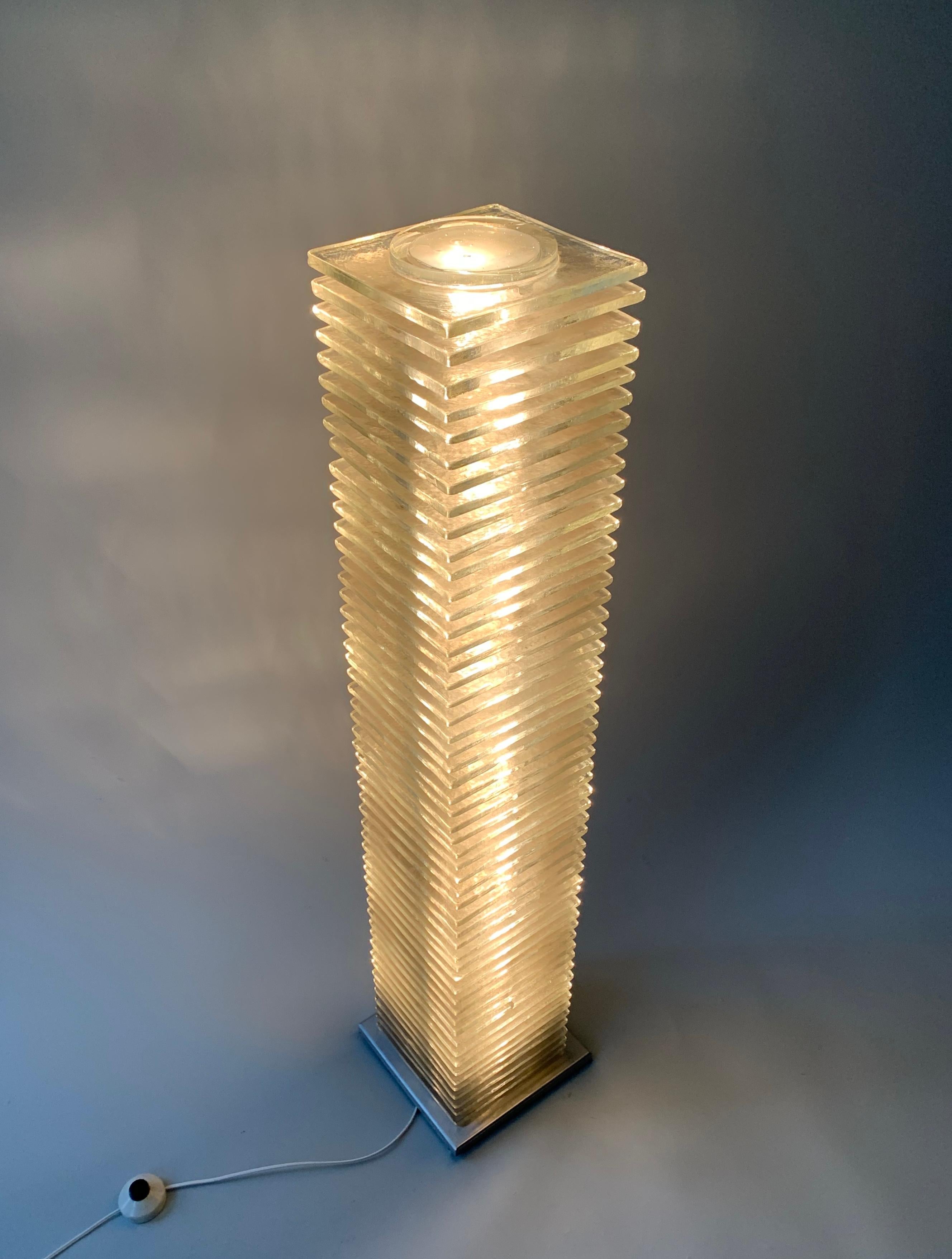 Designer: Poliarte

Item: “Lacerta” standing light

Date made: 1972

Material: stainless steel and cast glass

Size: 47.25” H x 9.75” W x 9.75” D 

Country : Italy