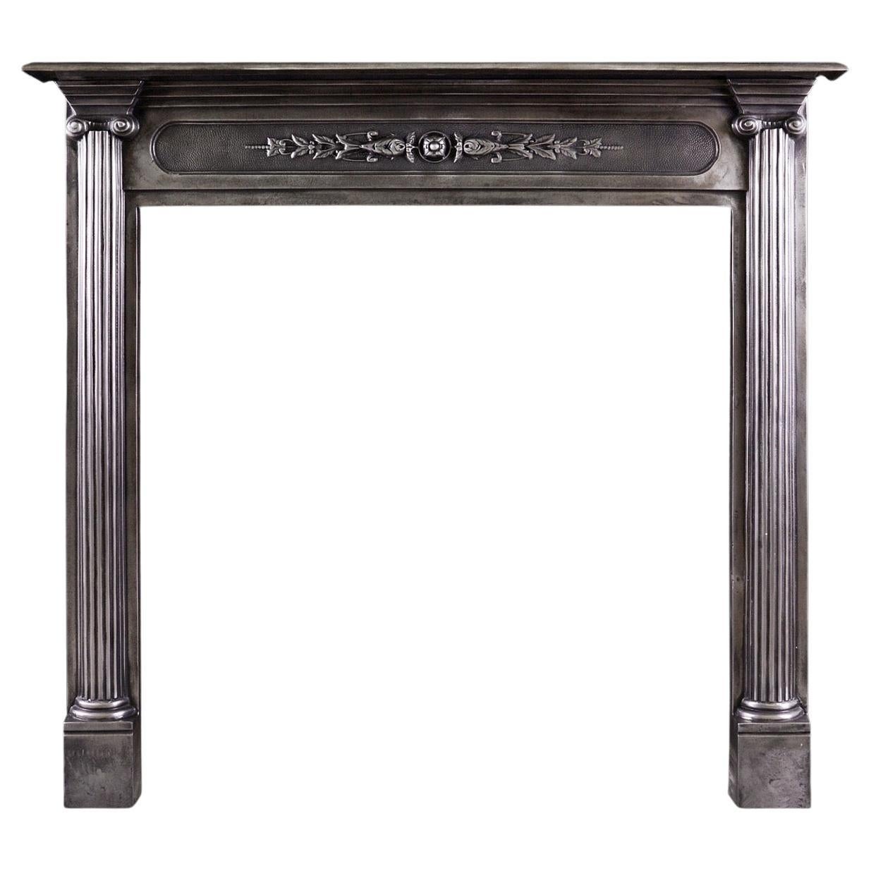 A Polished Cast Iron Fireplace in the Classical Style For Sale