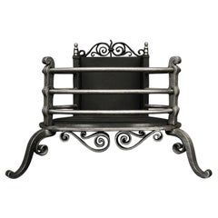 A Polished Iron Arts and Crafts Firegrate