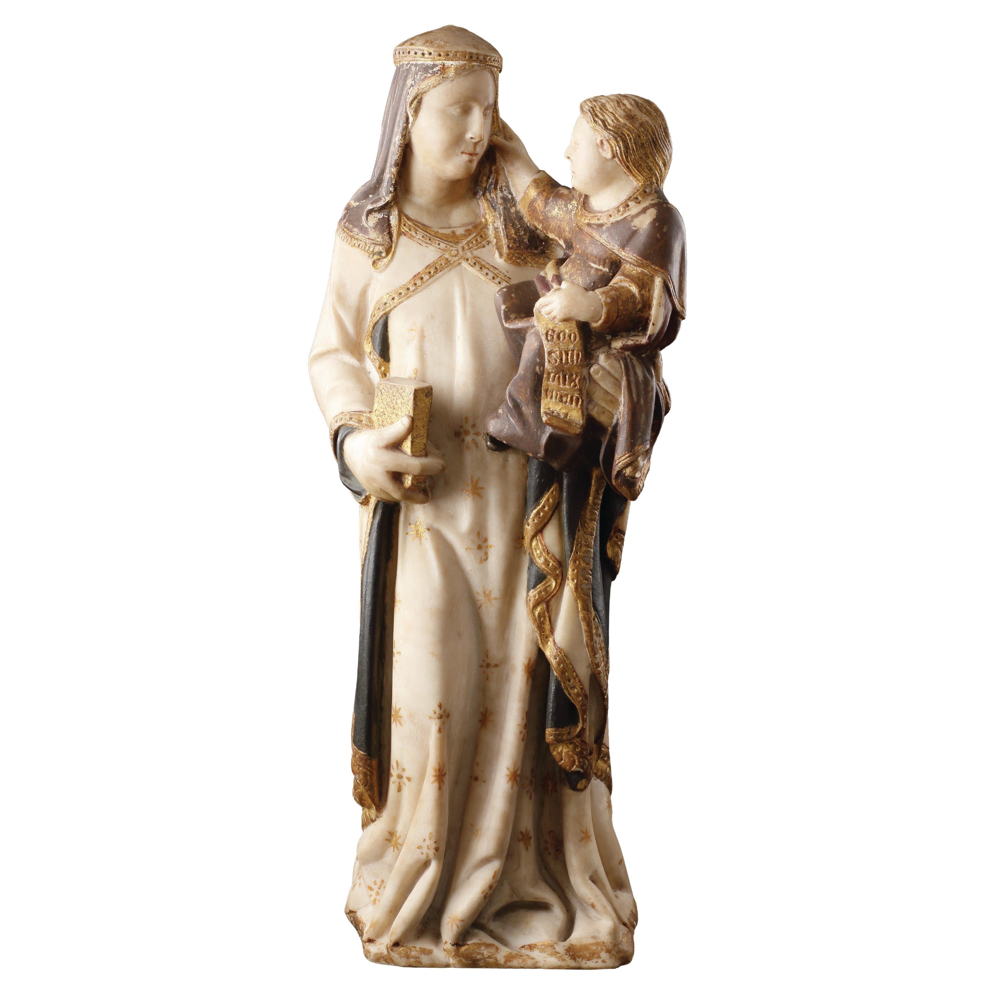 Groupe en marbre polychrome et parcellaire doré représentant la Vierge et l'Enfant