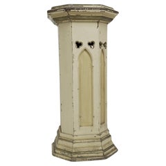 A polychrome painted octagonal pedestal with a graduated molded edge to the top