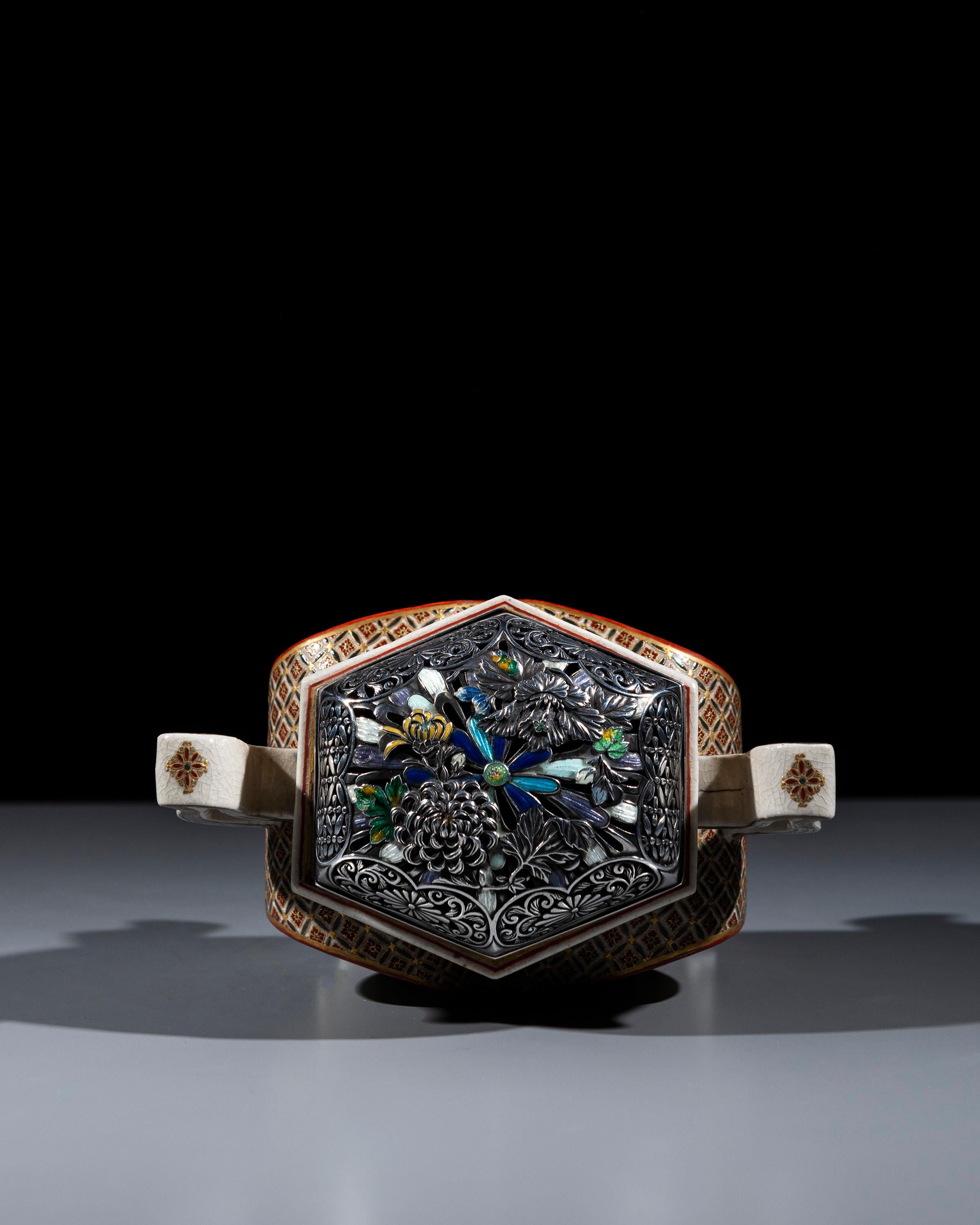 A Japanese Satsuma kōro decorated with polychrome enamels and gold on an ivory-toned ground, depicting courtly scenes, signed Ryokuzan. On both sides, the body features court scenes with elegantly dressed ladies, painted with great precision in the