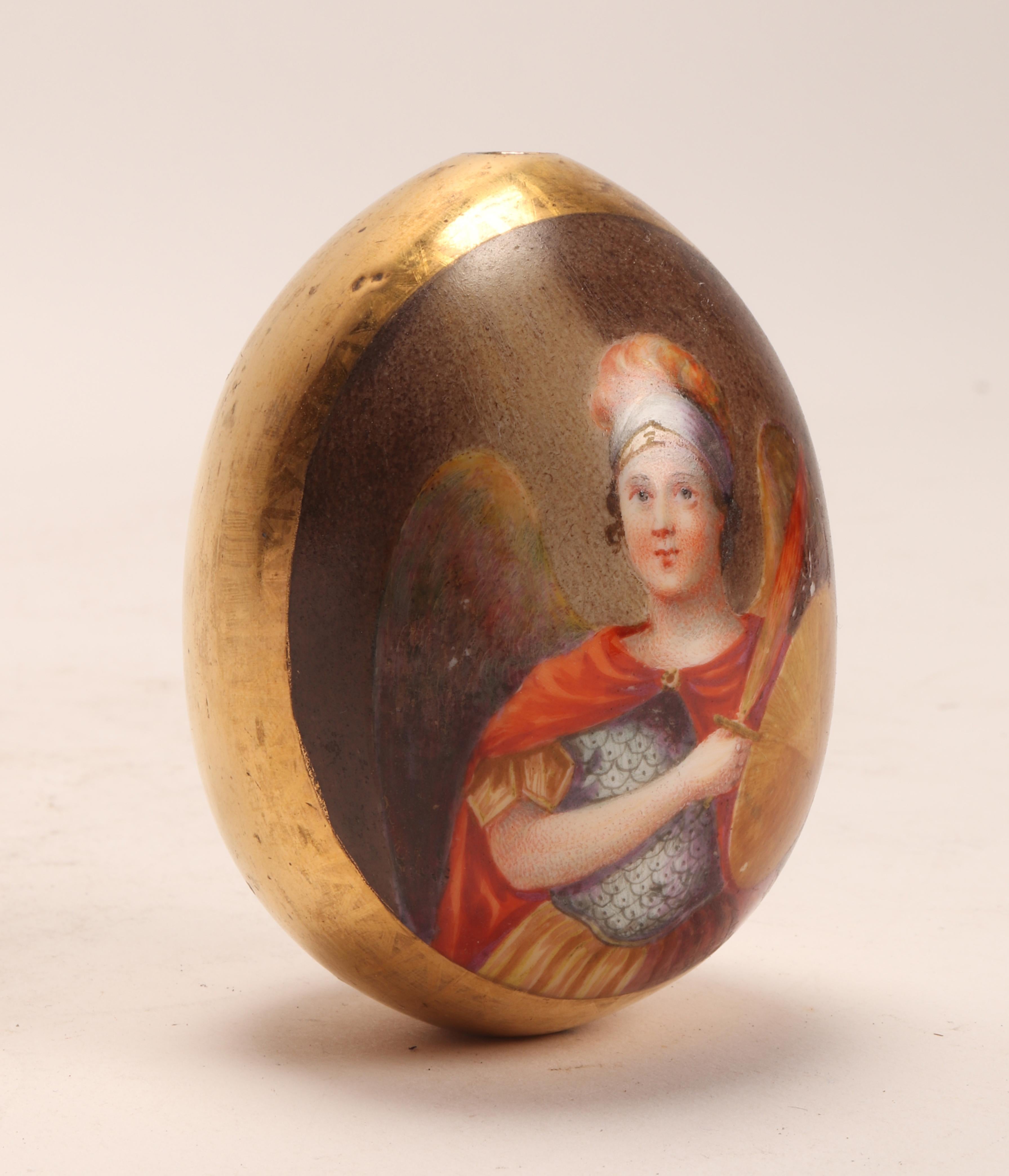 A painted porcelain Easter egg, depicting the icon with the Archangel Michael, on one side, while on the other side the cyrillic monogram: C.R. (Risen Christ), on a golden background. saint Petersburg, Russia, circa 1880.