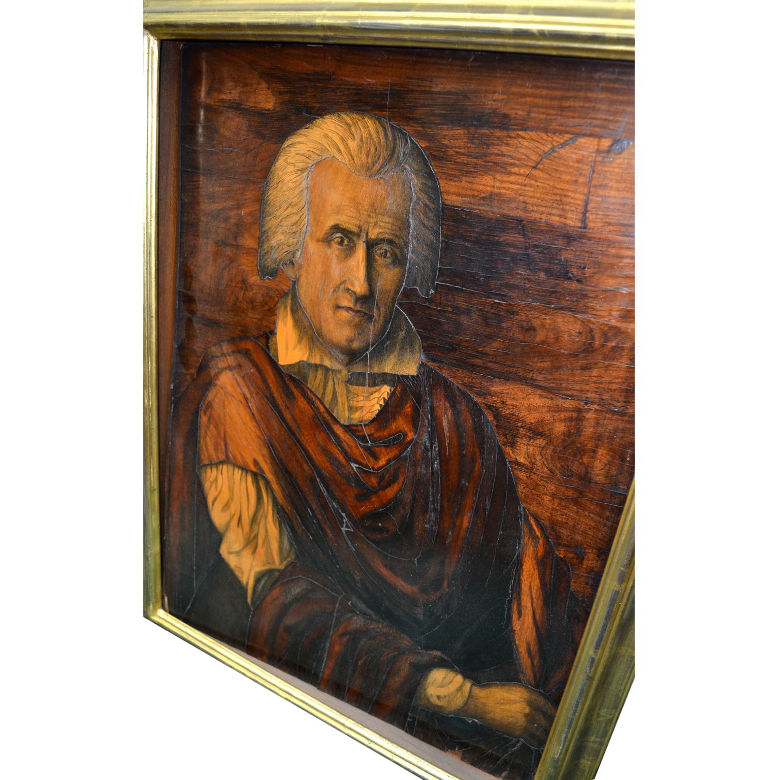 An 18th century portrait panel of possibly Christopher Columbus (or a classical philosopher) made from various types and treatments of inlaid woods, in a giltwood frame.

 