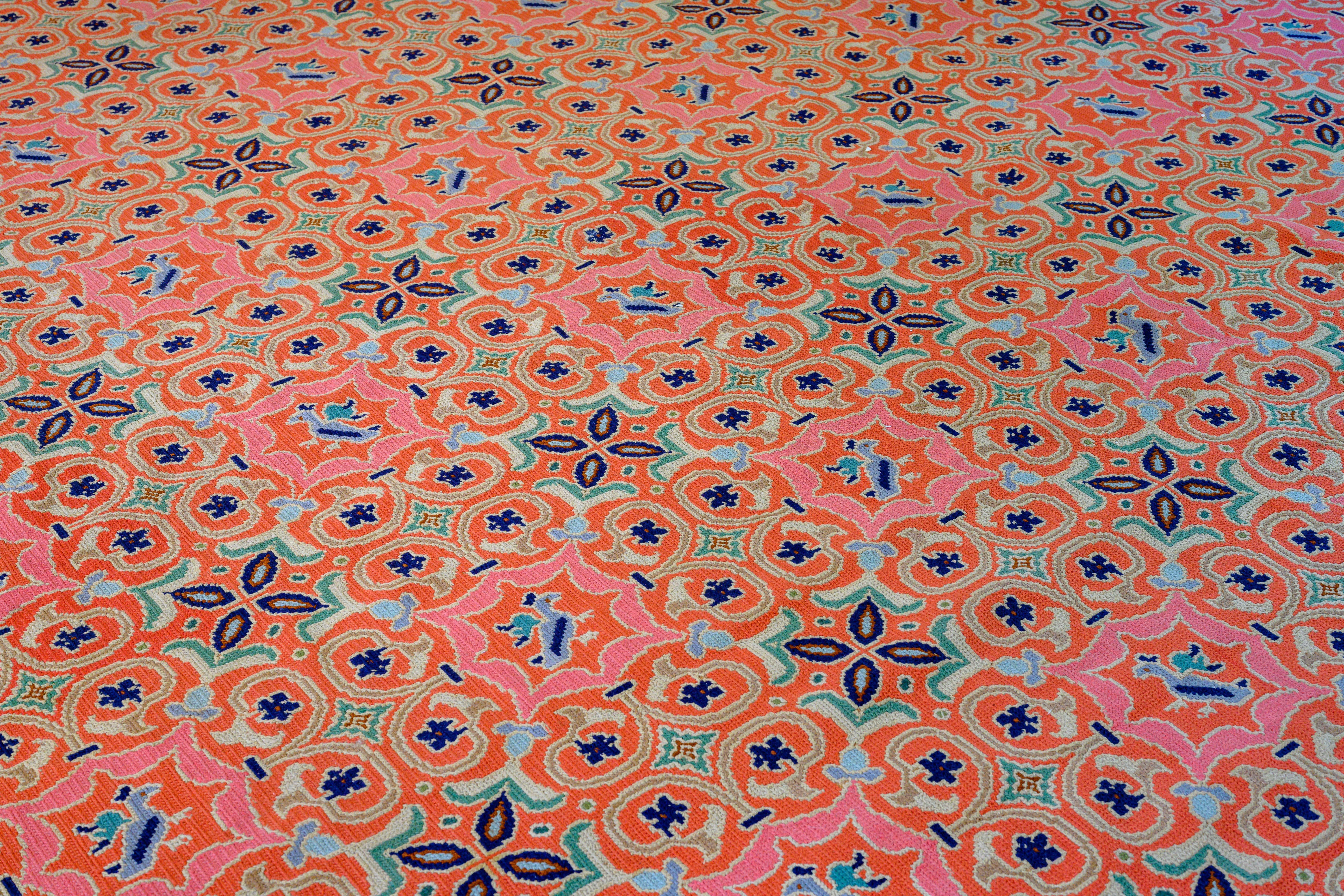 A Portugese vintage Arraiolos carpet, woven with needlework decoration inspired by the Spanish Moorish Azulejo tile designs, exceptionally large, fresh colors, circa 1980.

The city Arraiolos developed after political shifts that occurred in
