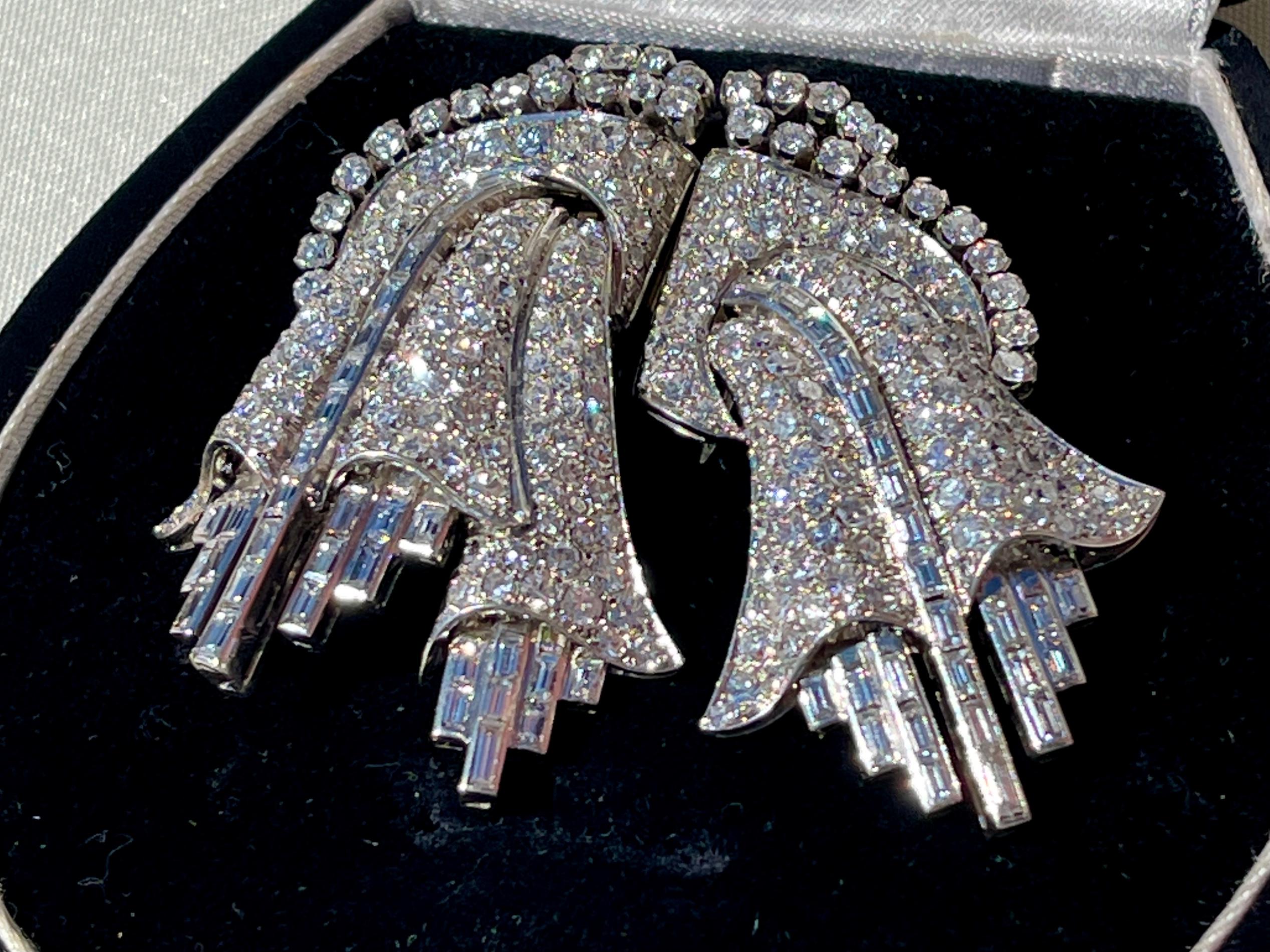 A Breathtaking and unique Portuguese Diamond Art Deco double Clip/ Brooch representing two hanging flowers.

This eye catching Art Deco diamond brooch is composed of platinum and high karat Portuguese white Gold (19.2 Karats). 

A Stunning 15 Carats