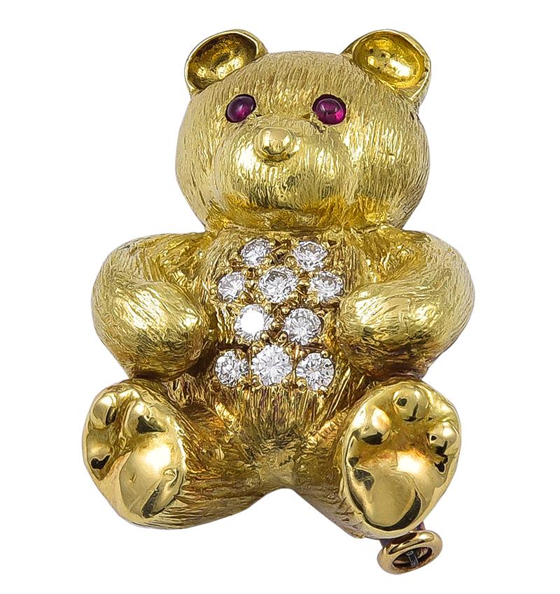 Teddy has Cabochon Ruby eyes and a 10 stone Diamond body with striated Gold 