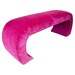 A post modern sculptural hot pink waterfall bench, circa 1980s