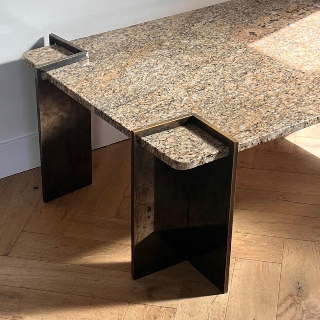 Post-Modern A postmodern granite and steel coffee table, 1970s