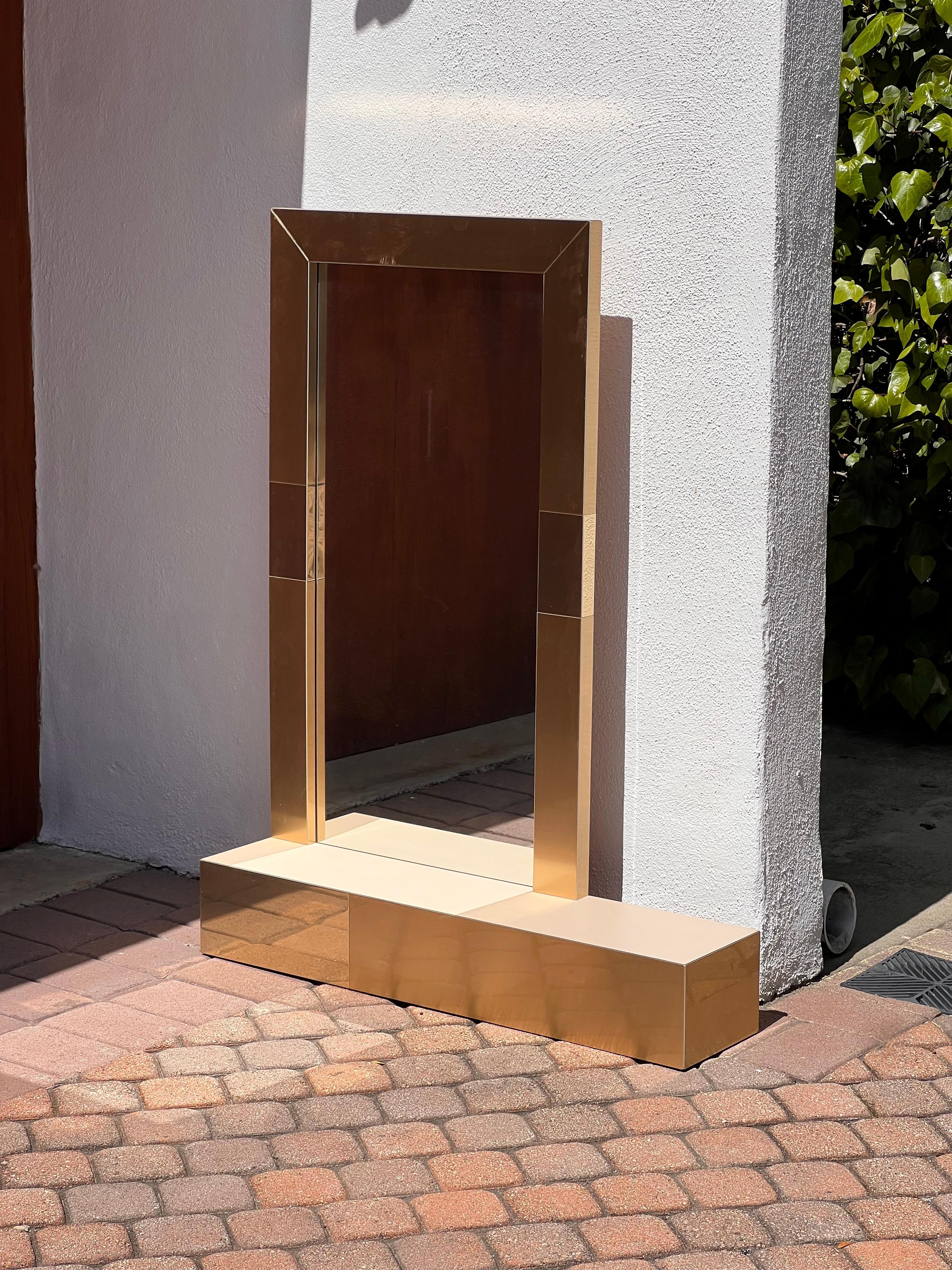 A postmodern Paul Evans style metallic mirror with shelf, late 20th century For Sale 1