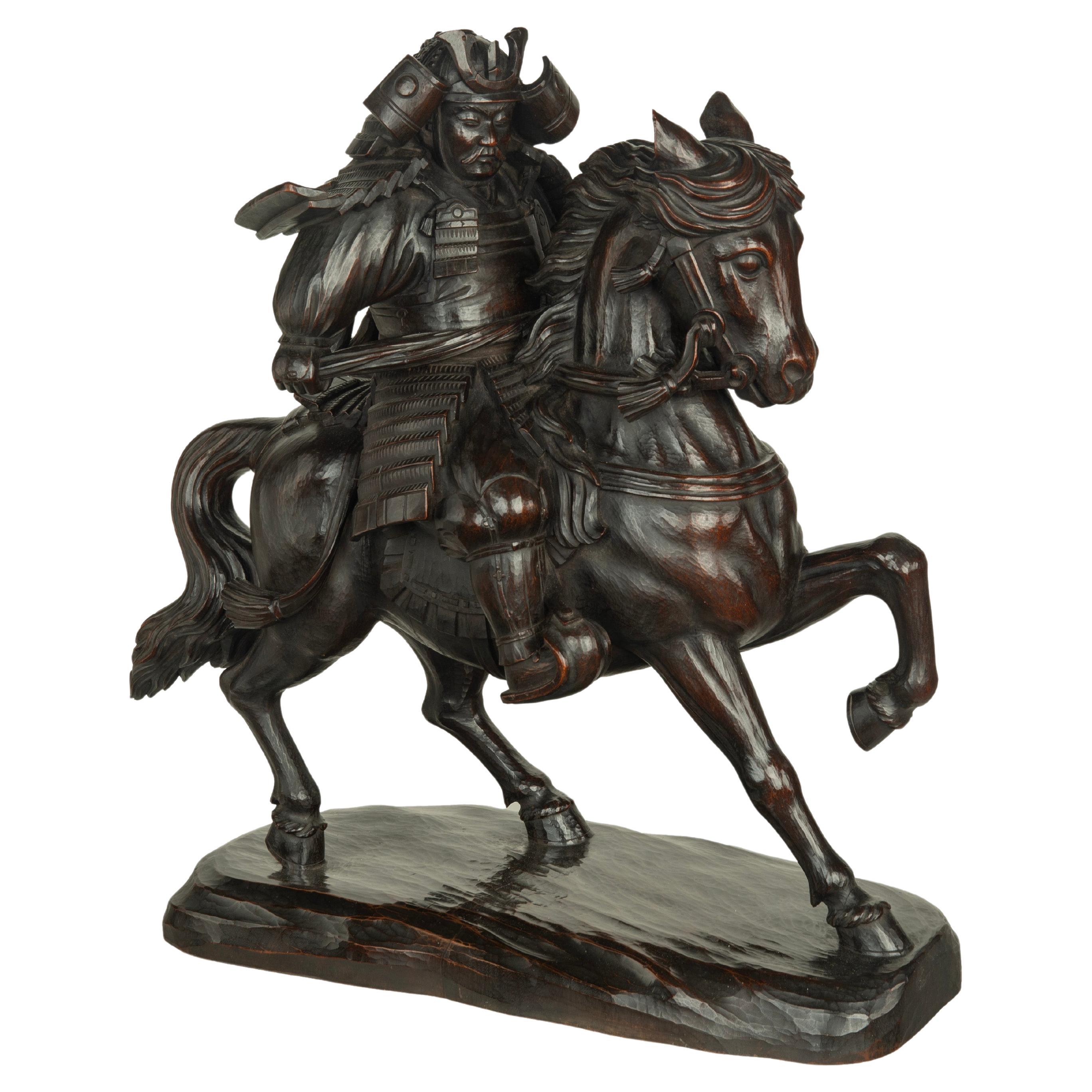 A powerful Japanese equestrian wood carving of a samurai by Yoshida Issen/Isshun For Sale