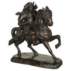 Antique A powerful Japanese equestrian wood carving of a samurai by Yoshida Issen/Isshun