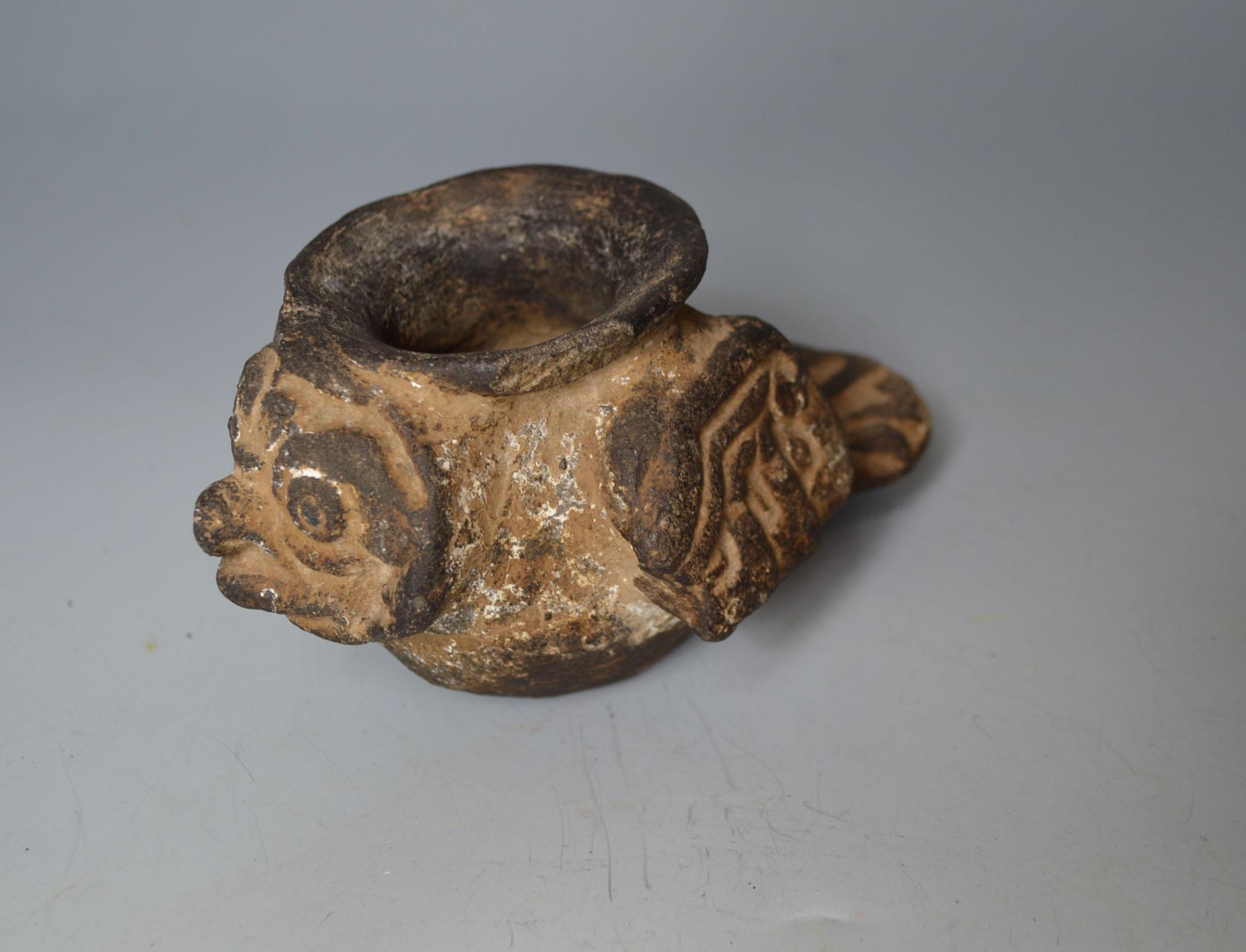 A Pre Columbian rare ancient Aztec stone avian container circa 1300-1521

A rare Aztec carved stone bowl or container in the shape of a bird with hieroglyph detail on wings
the outer surface with white pigment, probably a container for ritual