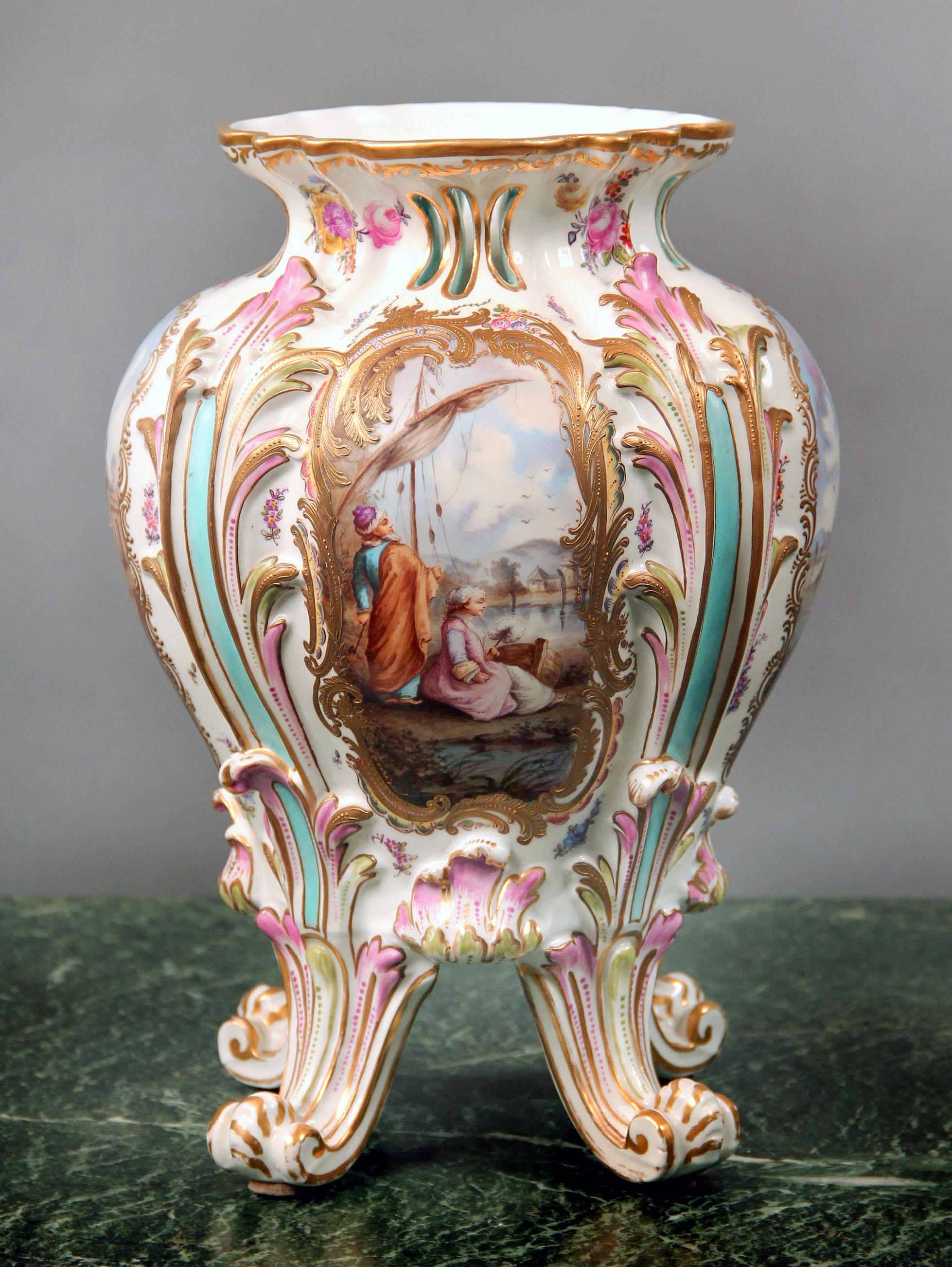 A Pretty Late 19th Century German Porcelain Vase

Four individual water scenes within raised gilt borders, the main scene is of a couple resting and looking towards the water.