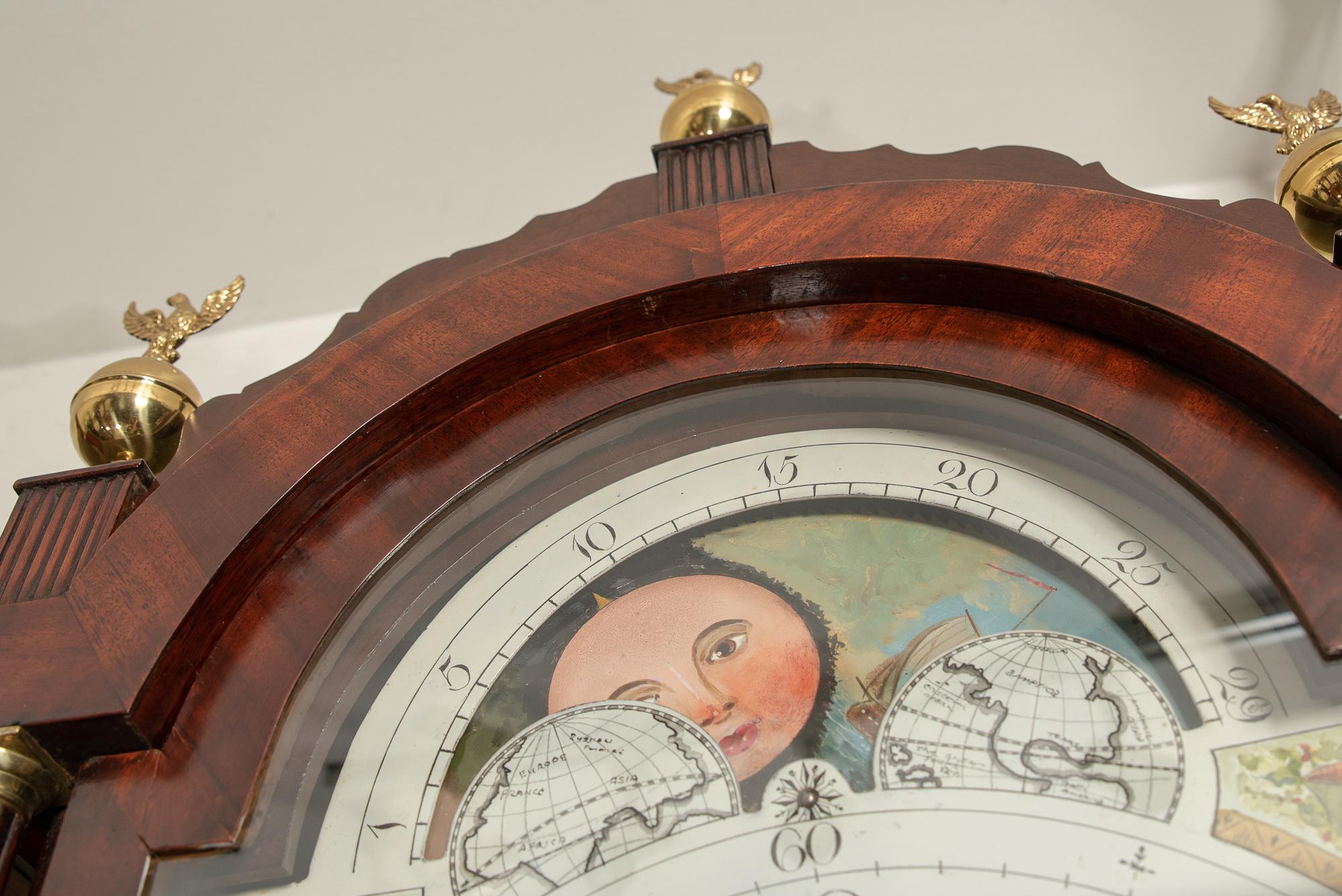 A very fine and elegant 8 day arched painted dial moon phase, striking the hours clock, by George Stephenson or Warminster (recorded 1788 - 1837).
In a slim mahogany case with reeded columns to hood and canted corners with ebony to trunk.