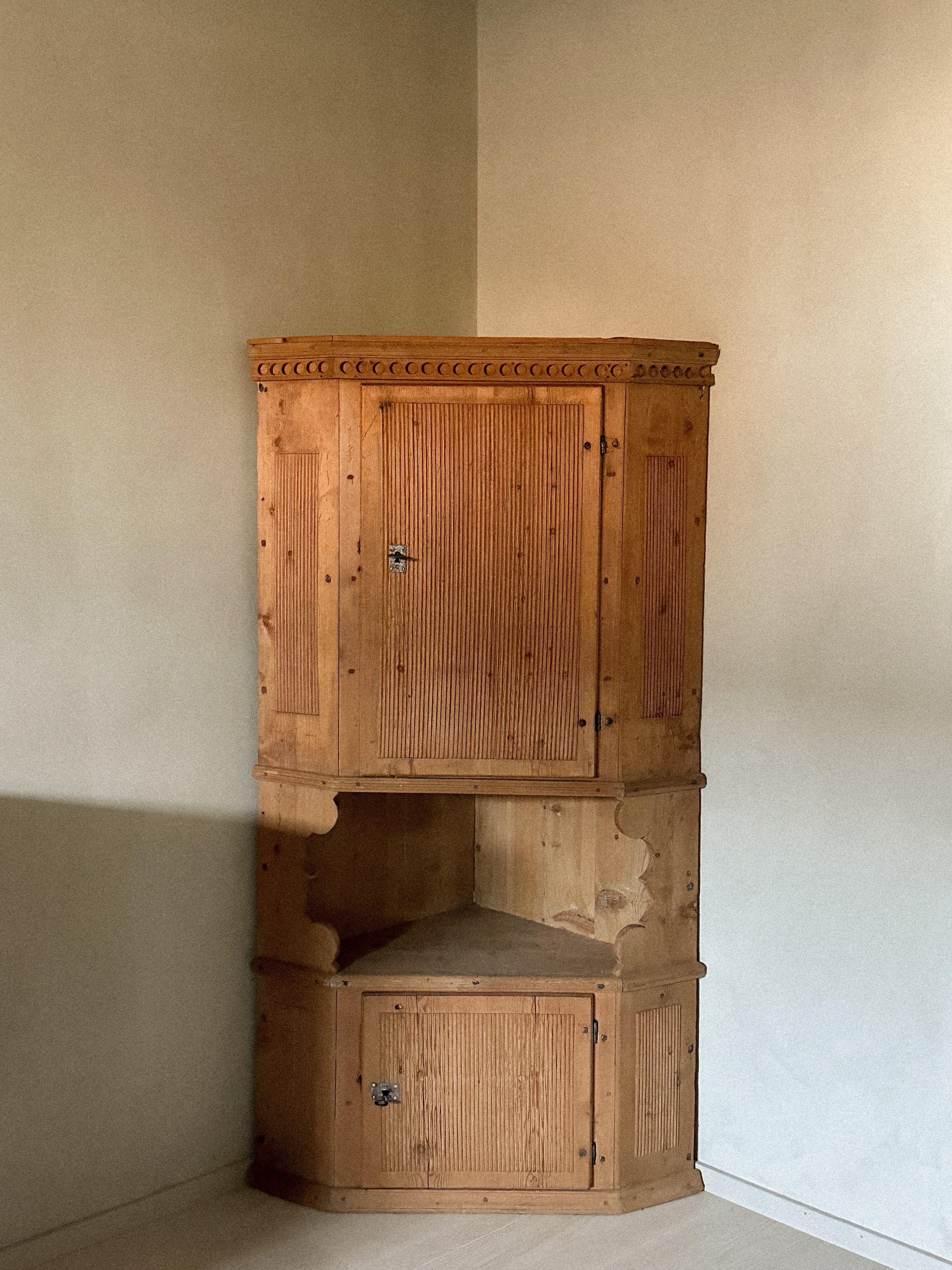 A Wonderful Primitive Corner Cupboard, Unknown designer, Scandinavia, c. 1800s. This case piece was meant  to hung on the wall in the dining room corner behind the man in the house. 