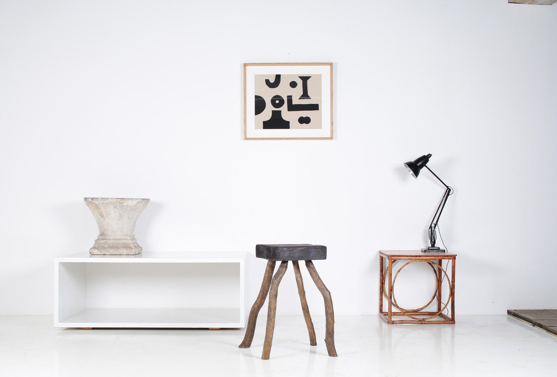 A beautiful natural wood stool or side table with an organic shape that embodies the principles of wabi-sabi, which celebrates imperfection, transience, and the beauty of natural materials. The piece has great from and presence, keeping the original